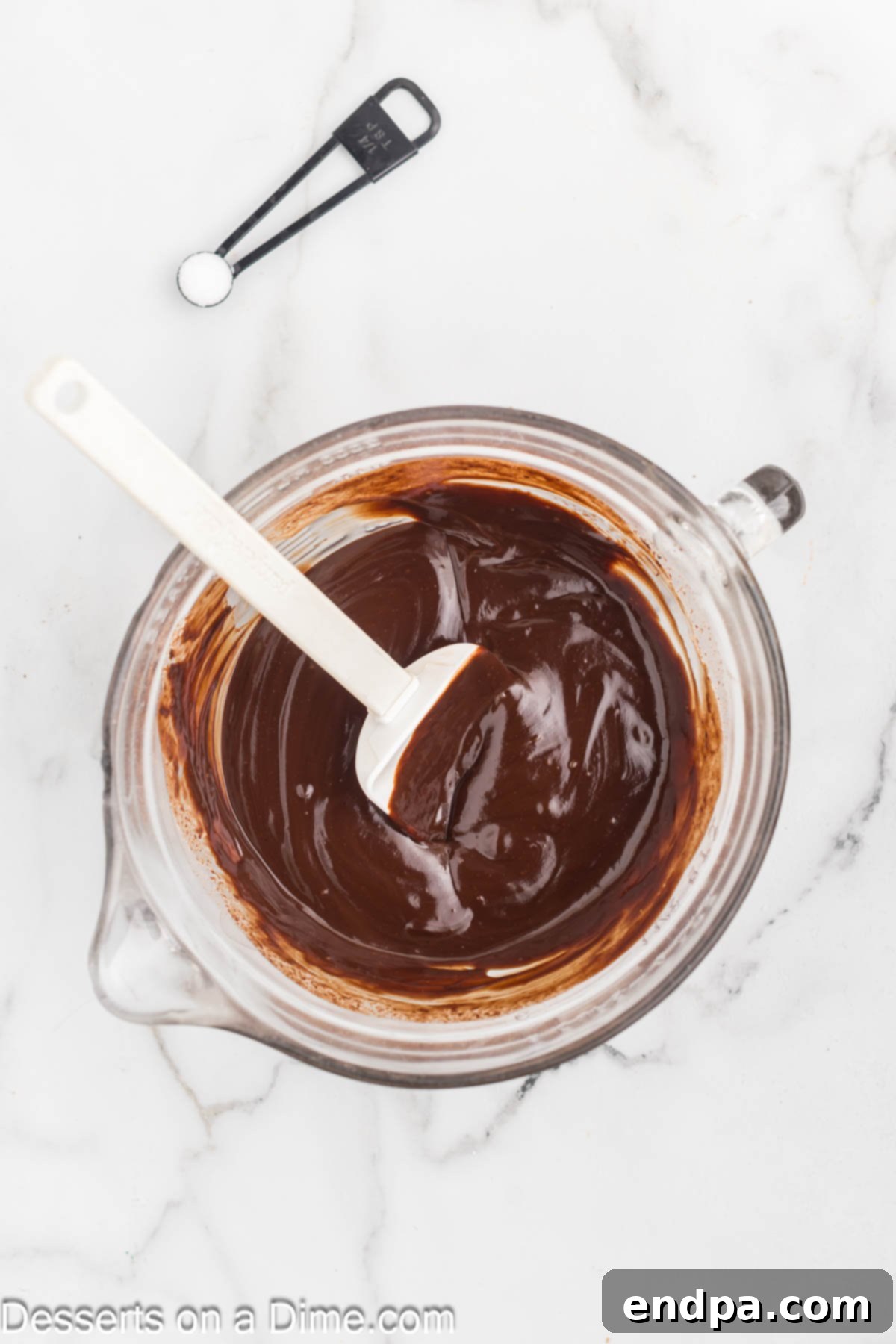 Decadent Chocolate Mousse Delight 4 Melted chocolate in a mixing bowl, ready to be combined.