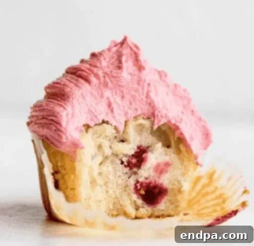 Sweet Valentines Cupcake Creations 14 Raspberry Cupcakes with fresh raspberries and icing.