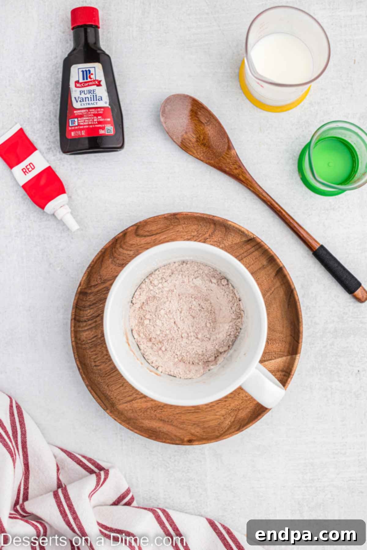 Wet and dry ingredients for mug cake combined in a large microwave-safe mug