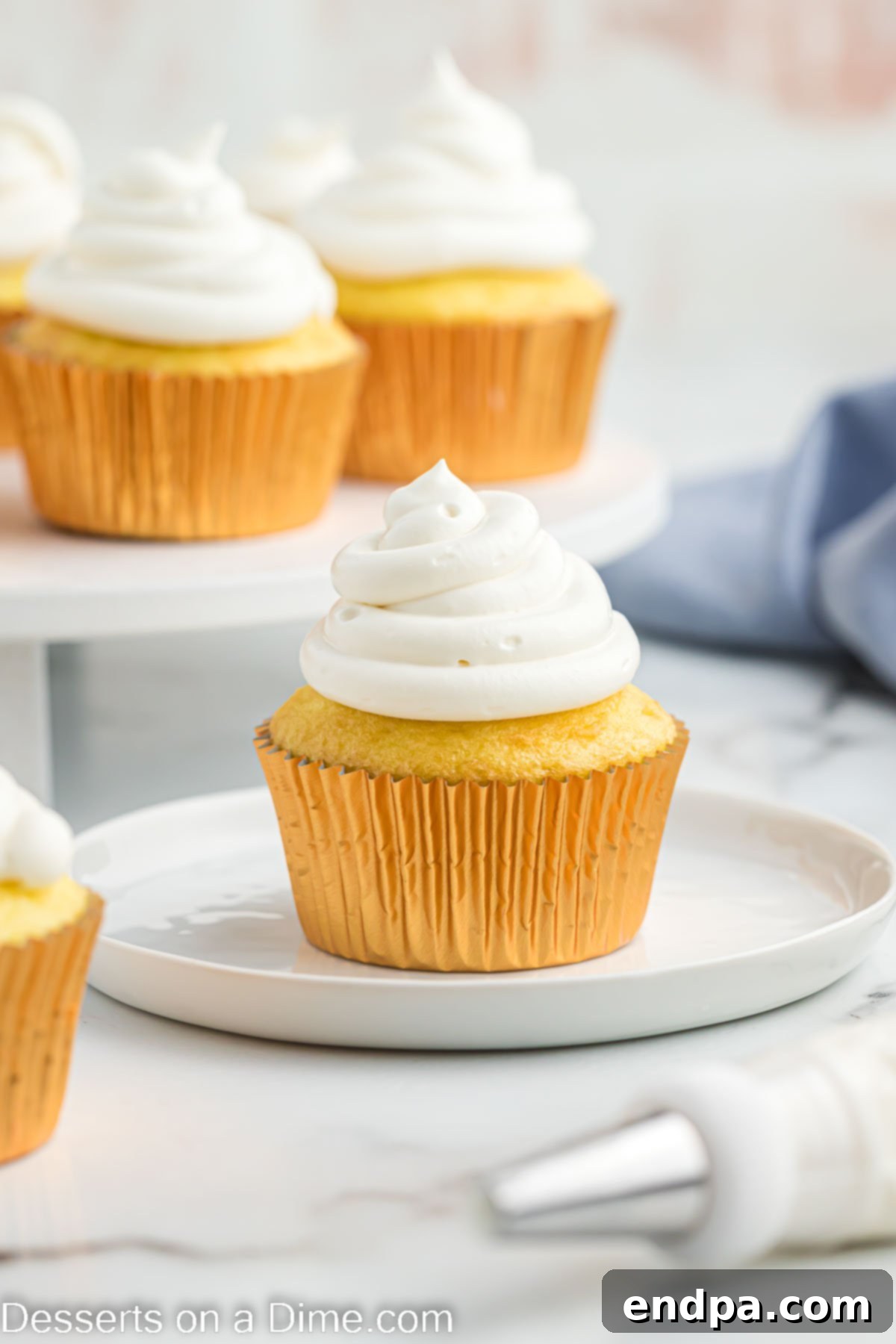 Cool whip cream cheese frosting on a cupcake, light and fluffy texture