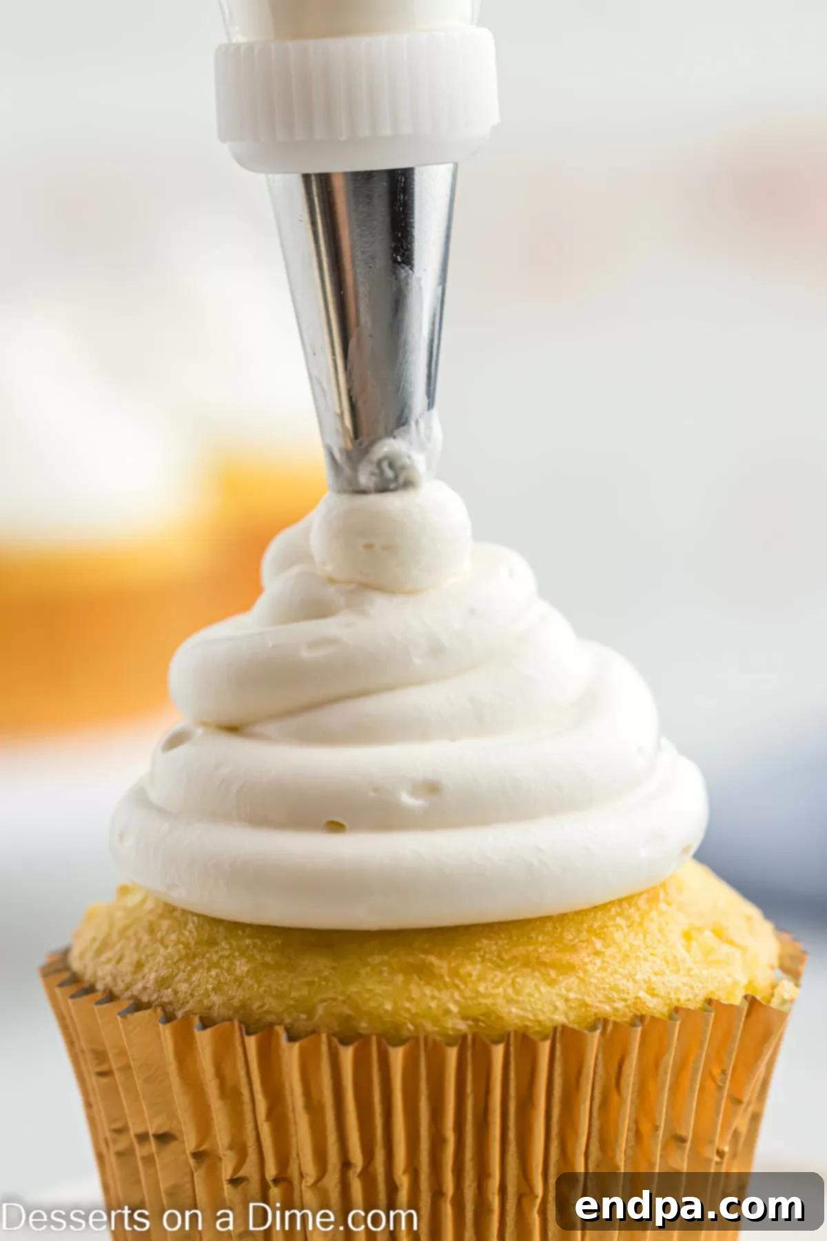 Cool Whip Cream cheese frosting piped beautifully onto a cupcake.