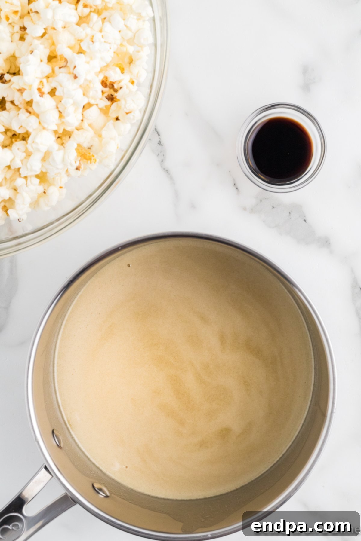 Butter and honey combined and melted in a pan on the stove.