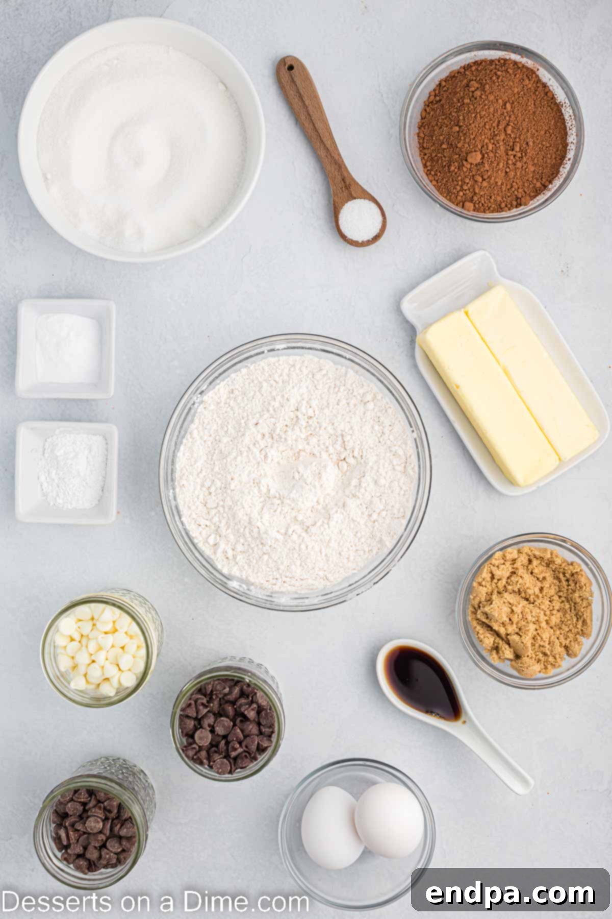 Various ingredients for Triple Chocolate Cookies including butter, brown sugar, eggs, vanilla, flour, baking soda, and assorted chocolate chips.
