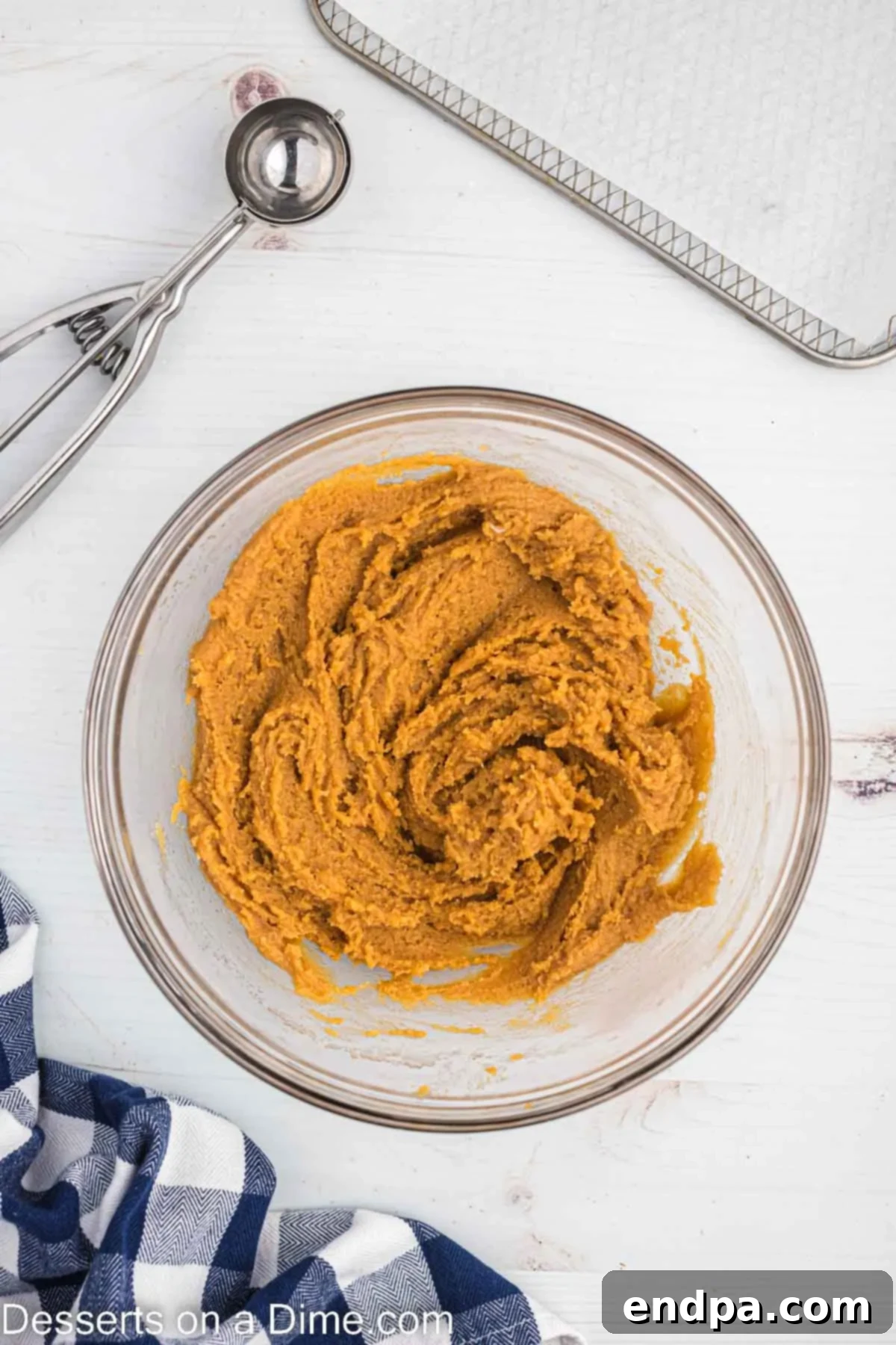 Peanut Butter cookie dough combined in a bowl.