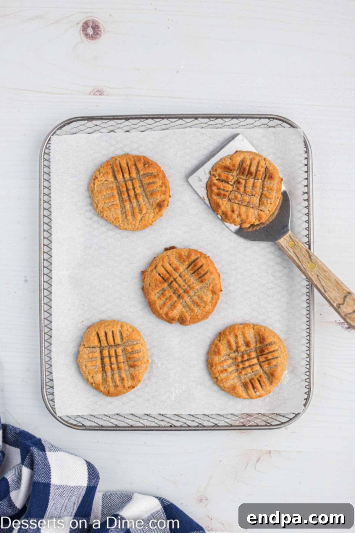 Cookies cooling and moved with a spatula. 