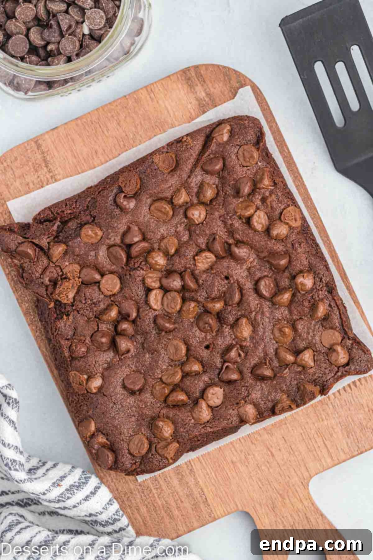 Air fryer brownies on cutting board.