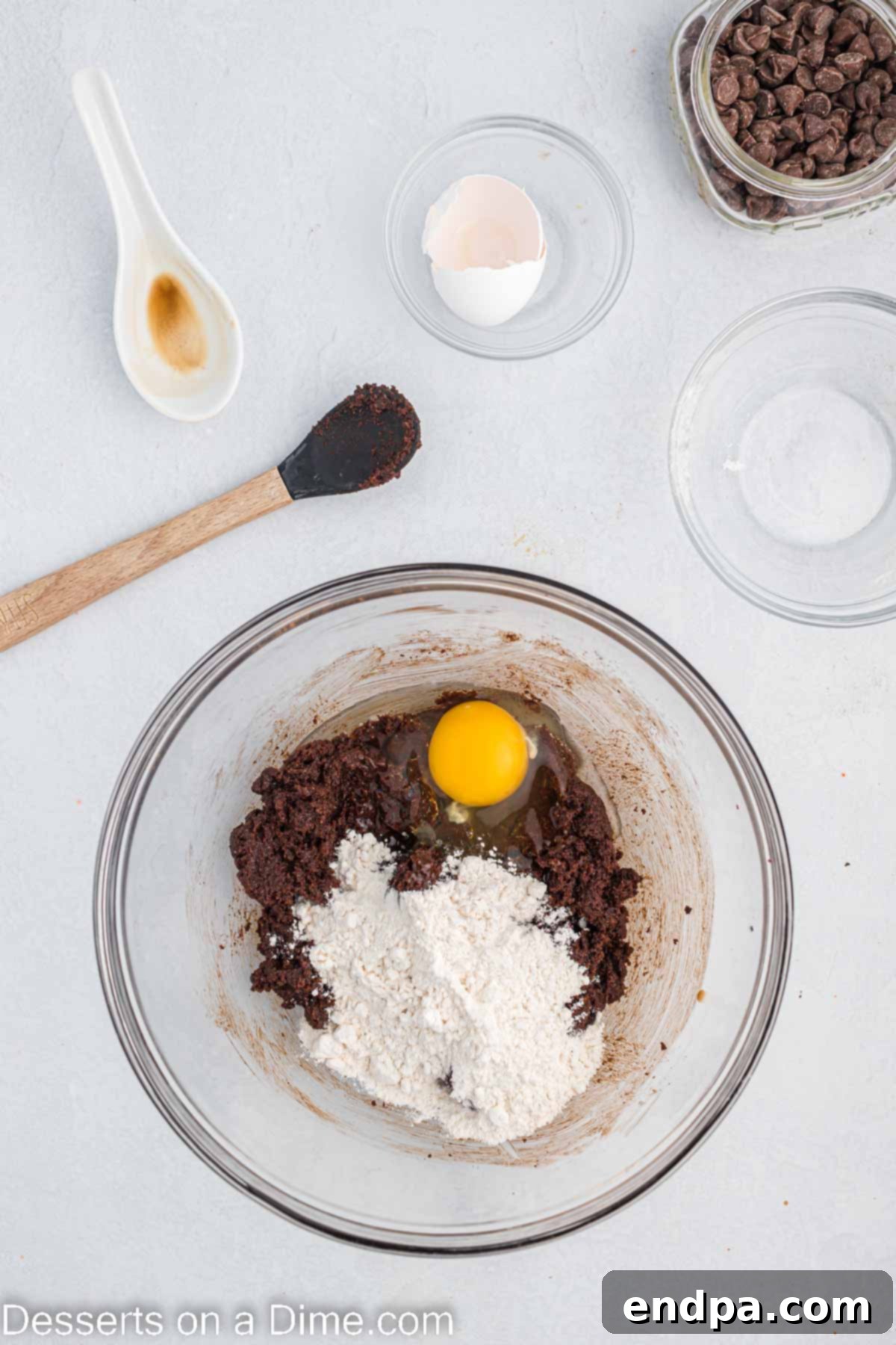 Flour and egg whisked into bowl.