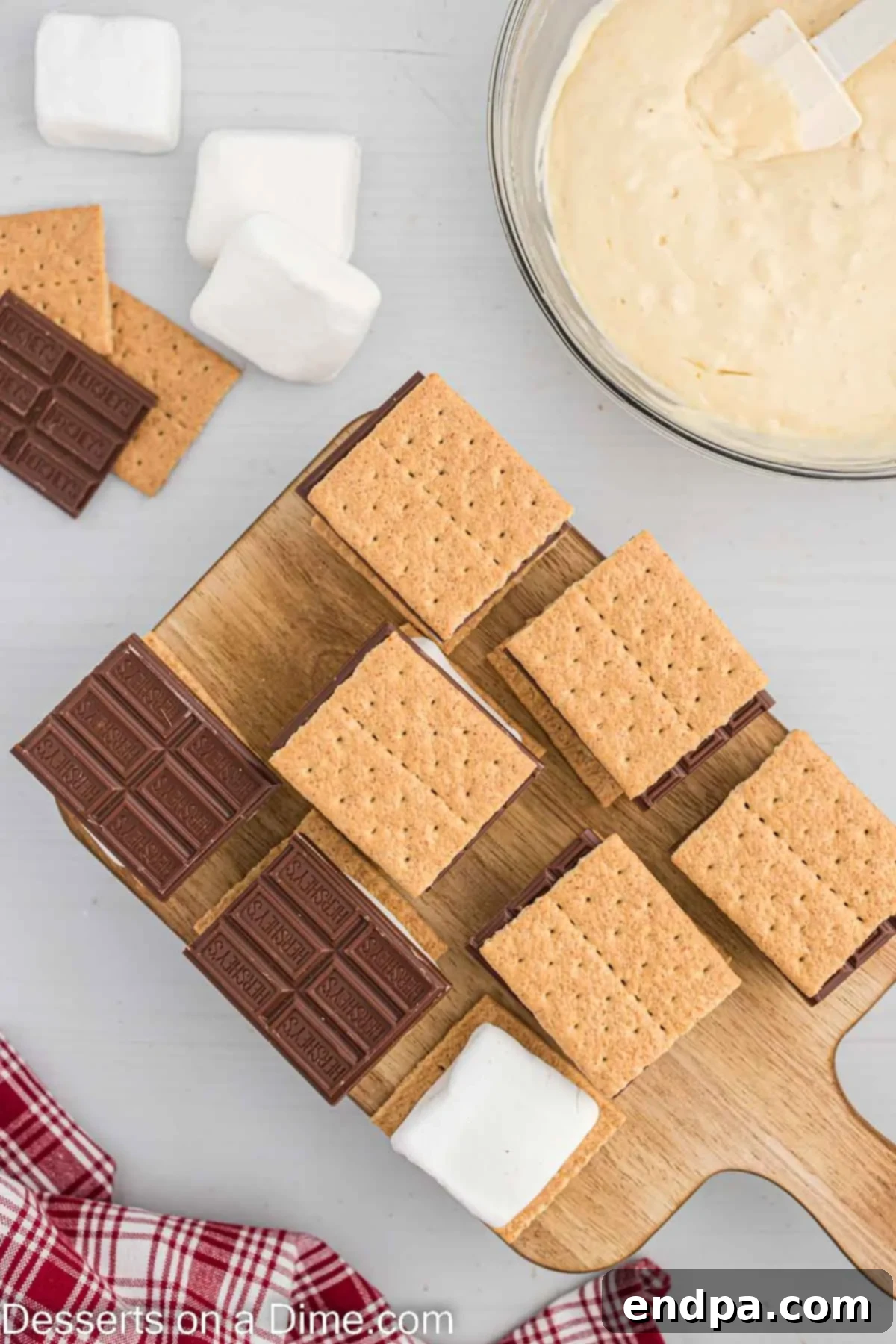 Crispy Golden Smores Delight 5 Assembled S'mores ready for frying, with graham crackers, marshmallow, and chocolate.