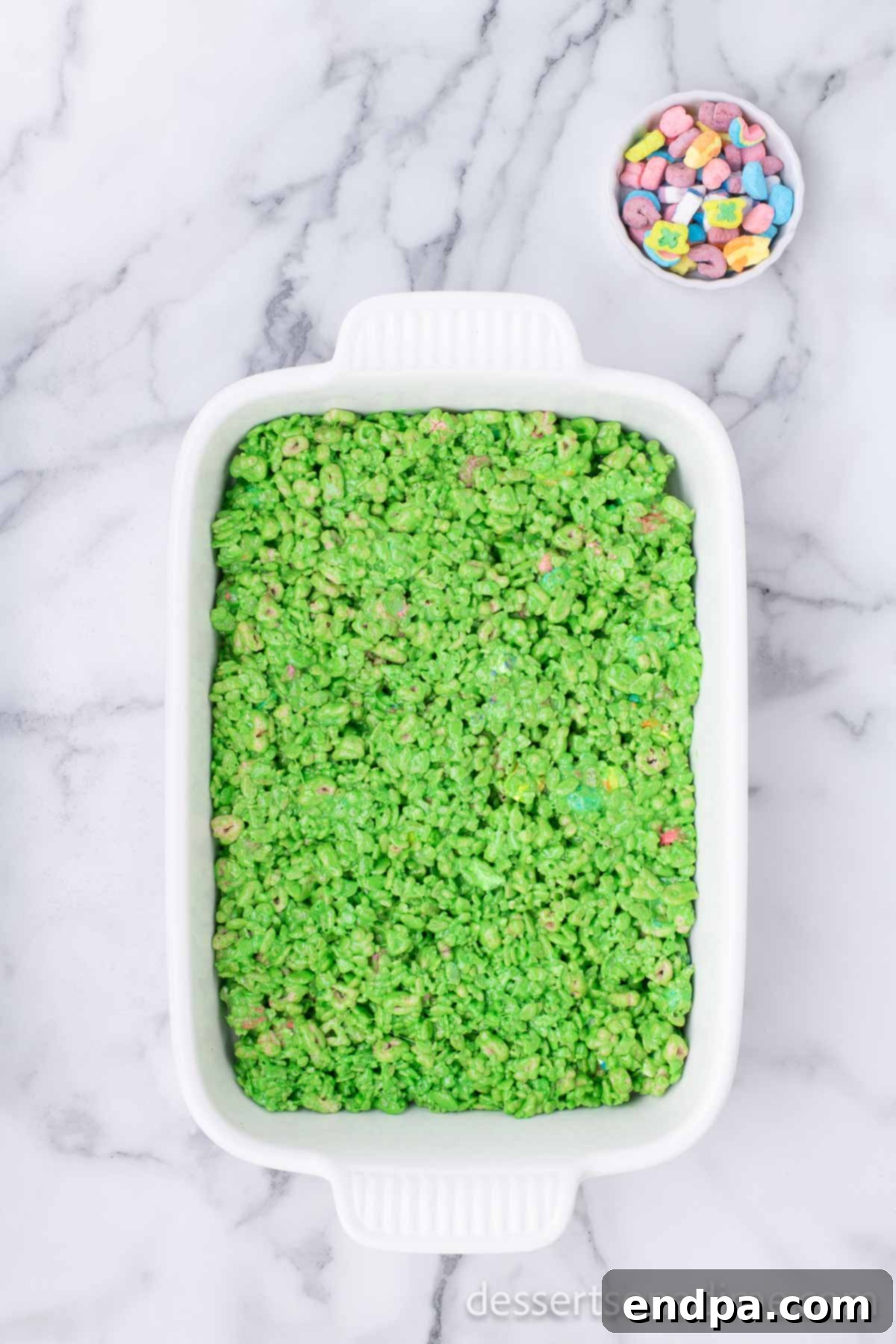 Shamrock Krispie Squares 7 The cereal mixture evenly pressed into a baking dish.