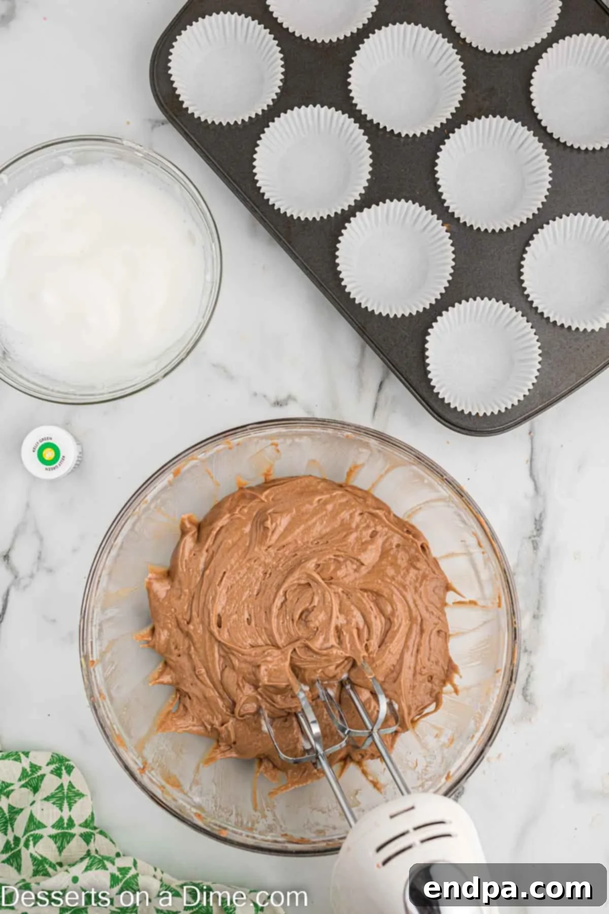 Alternating additions of dry ingredients and buttermilk into the wet mixture, creating a smooth batter.