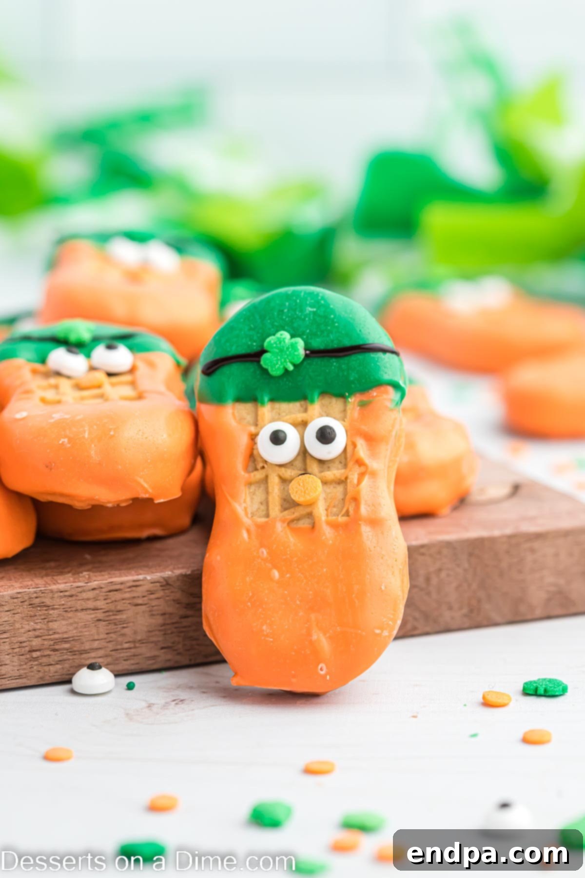 Lucky Leprechaun Bites 10 A collection of beautifully decorated Leprechaun cookies showcasing their detailed features and vibrant colors, arranged on a surface.