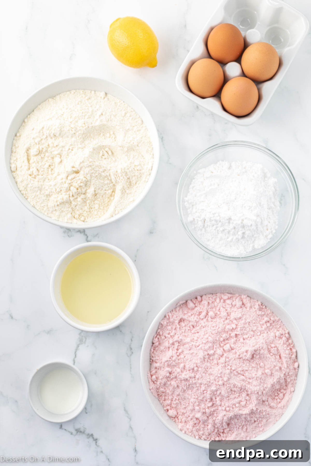 Tangy Strawberry Lemonade Cookies 3 A selection of ingredients for Strawberry Lemonade Cookies including strawberry cake mix, lemon cake mix, eggs, lemon juice, powdered sugar, and milk.