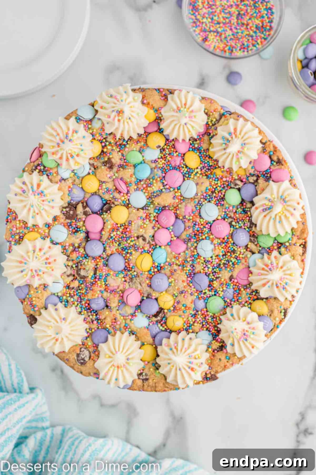 Baked and cooled Easter Cookie Cake with decorative frosting piped around the edges