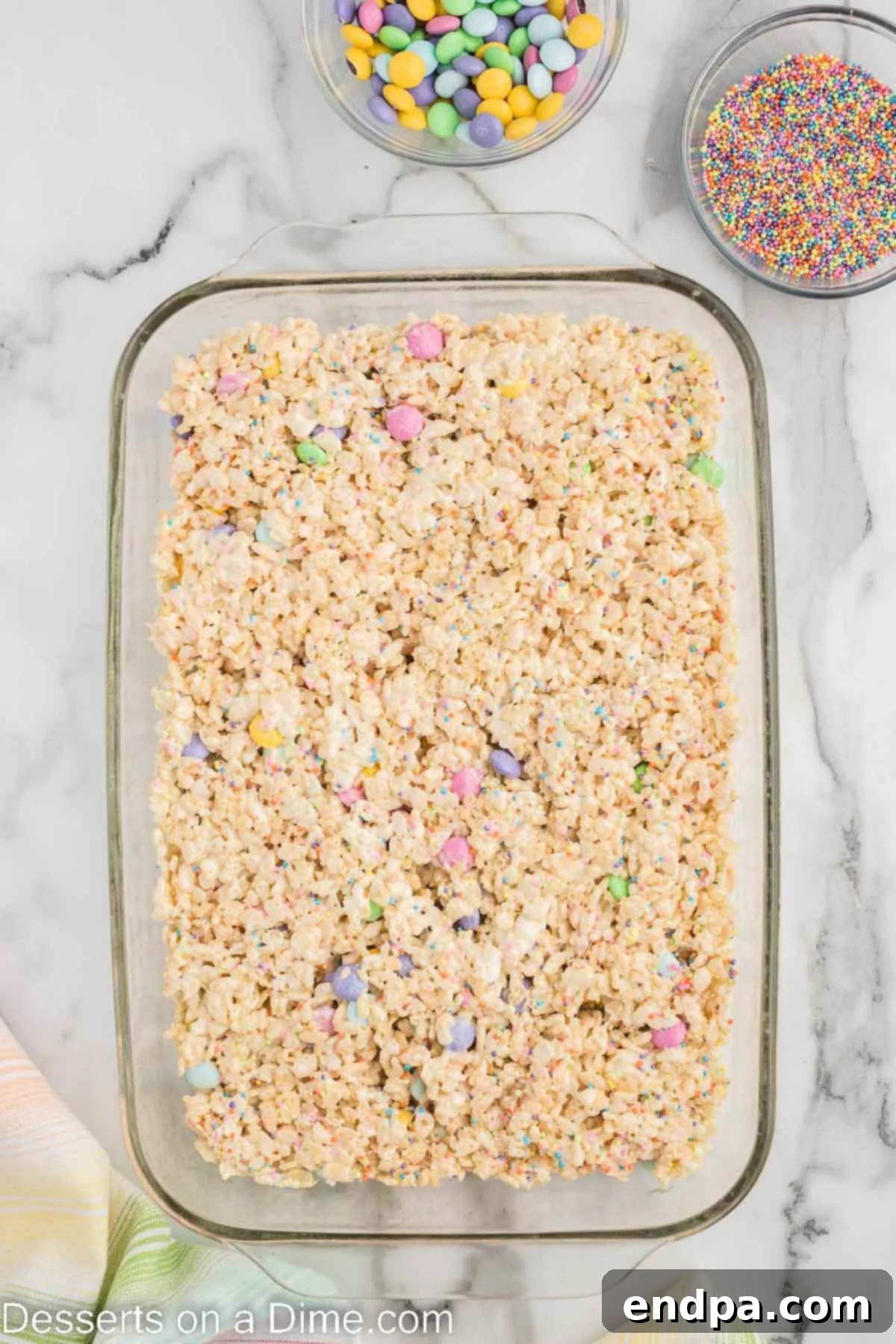 Springtime Krispie Delights 6 Crispy rice cereal mixture pressed into a baking dish.
