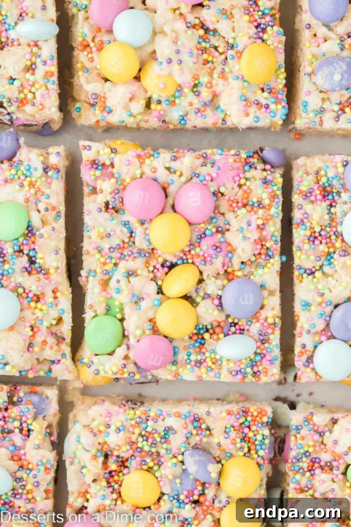 Springtime Krispie Delights 8 Easter Rice Krispie Treats cut into squares, ready for serving.