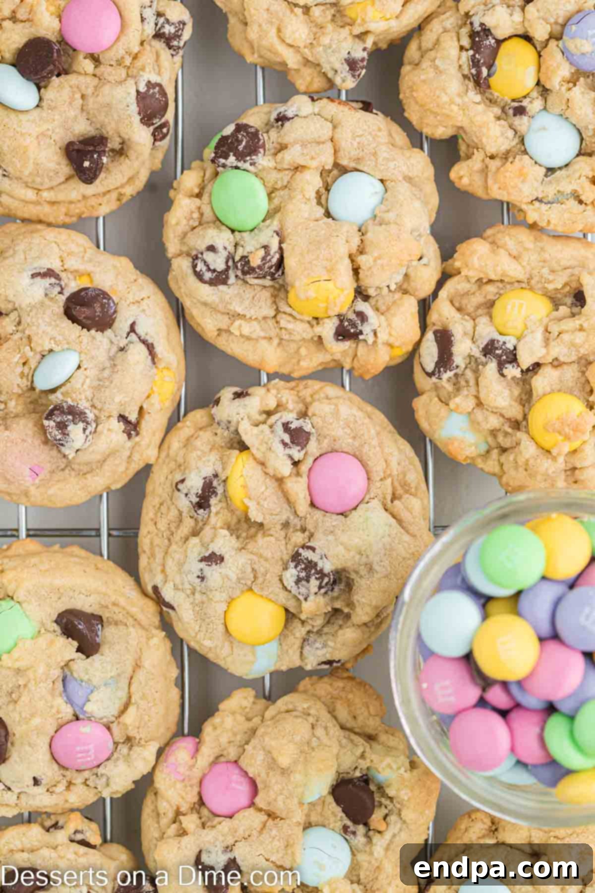Hoppy Easter Chocolate Chip Cookies 2 Easter Chocolate Chip Cookies cooling on a wire rack, showcasing their soft texture and colorful M&M's.