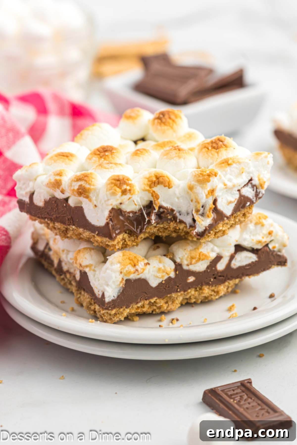 Gooey S'mores Delights 10 S'mores Bars arranged neatly on a plate, ready to be enjoyed.