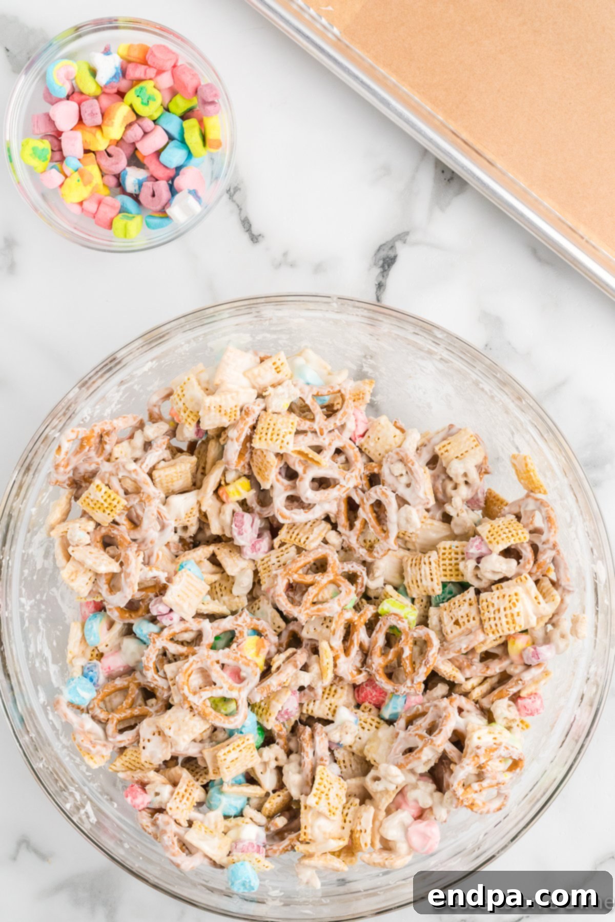 The Leprechaun's Lure 6 The cereal mixture in a bowl, thoroughly coated with melted white chocolate and glistening.