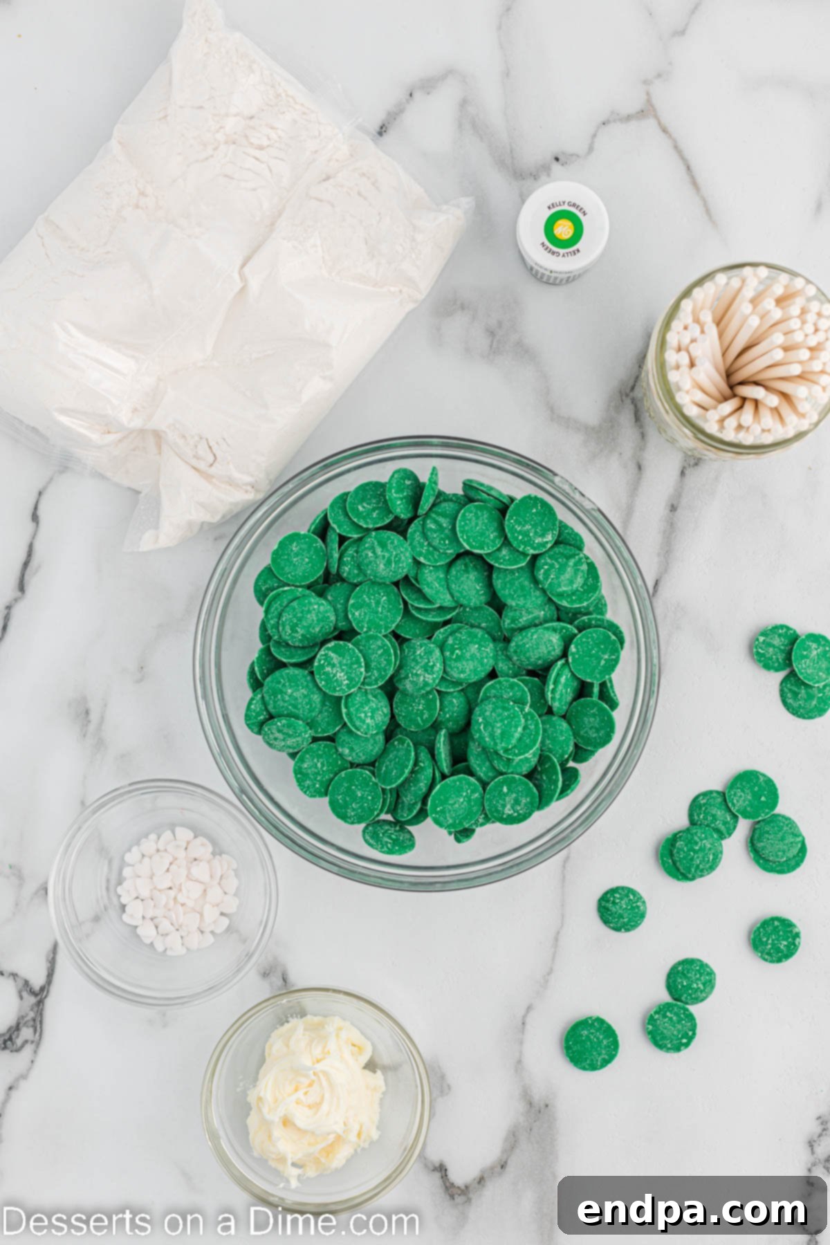 Lucky St Patricks Day Cake Pops 3 Ingredients needed for St Patrick's Day Cake Pops - boxed cake mix, green food coloring, cream cheese frosting, cake pop sticks, green candy melts, white heart sprinkles