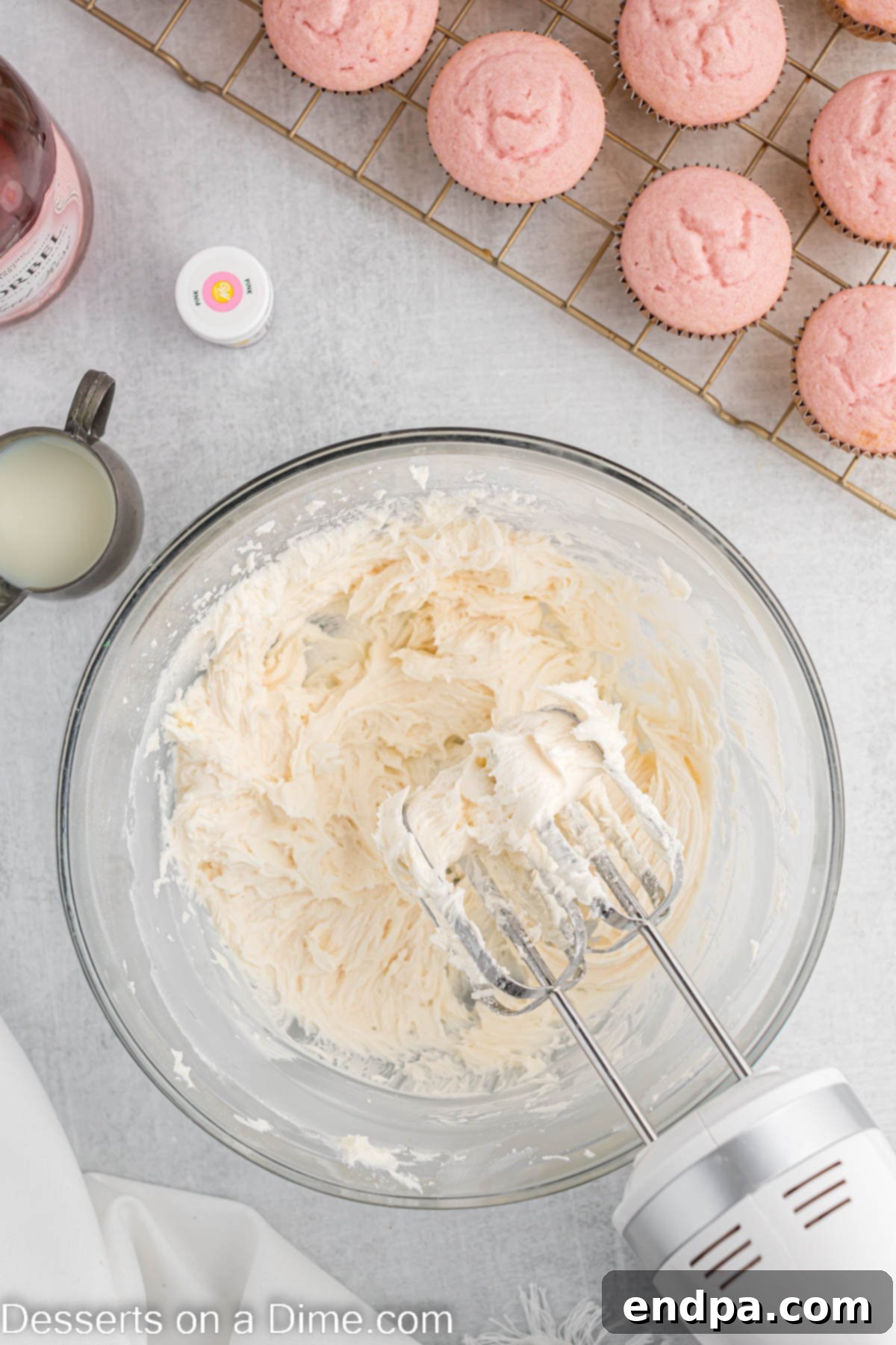 A medium bowl containing the creamy, smooth buttercream frosting, before adding coloring.