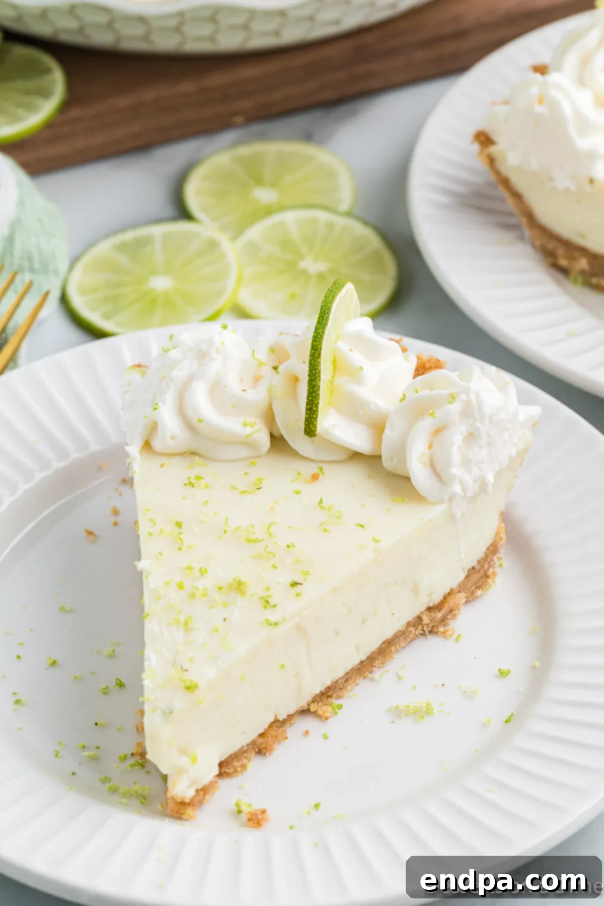 Foolproof Tangy Key Lime Pie 2 Slice of key lime pie on a plate.