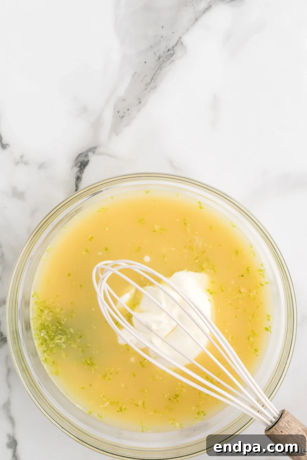 Foolproof Tangy Key Lime Pie 6 Pie filling added to mixing bowl.