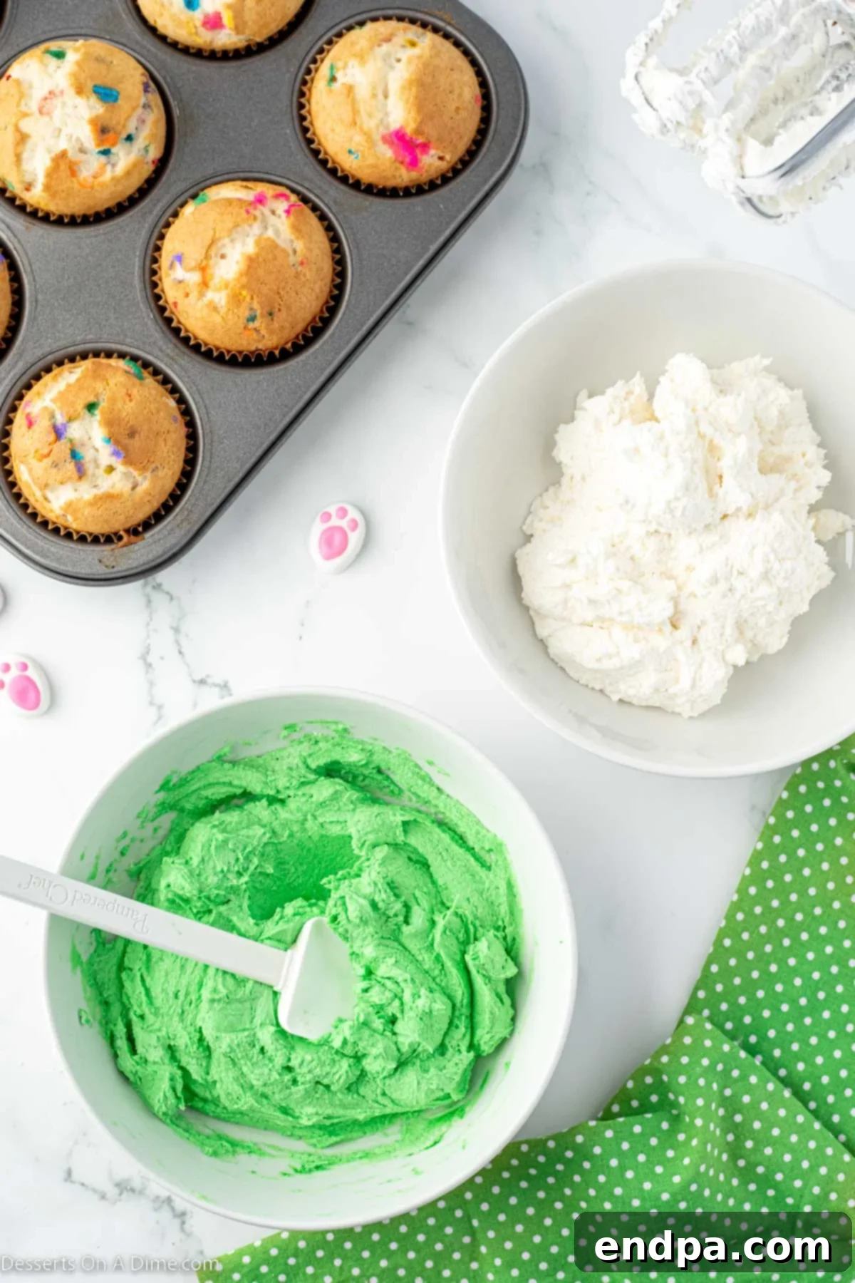 Mixing bowl with homemade white buttercream frosting, after powdered sugar has been added.
