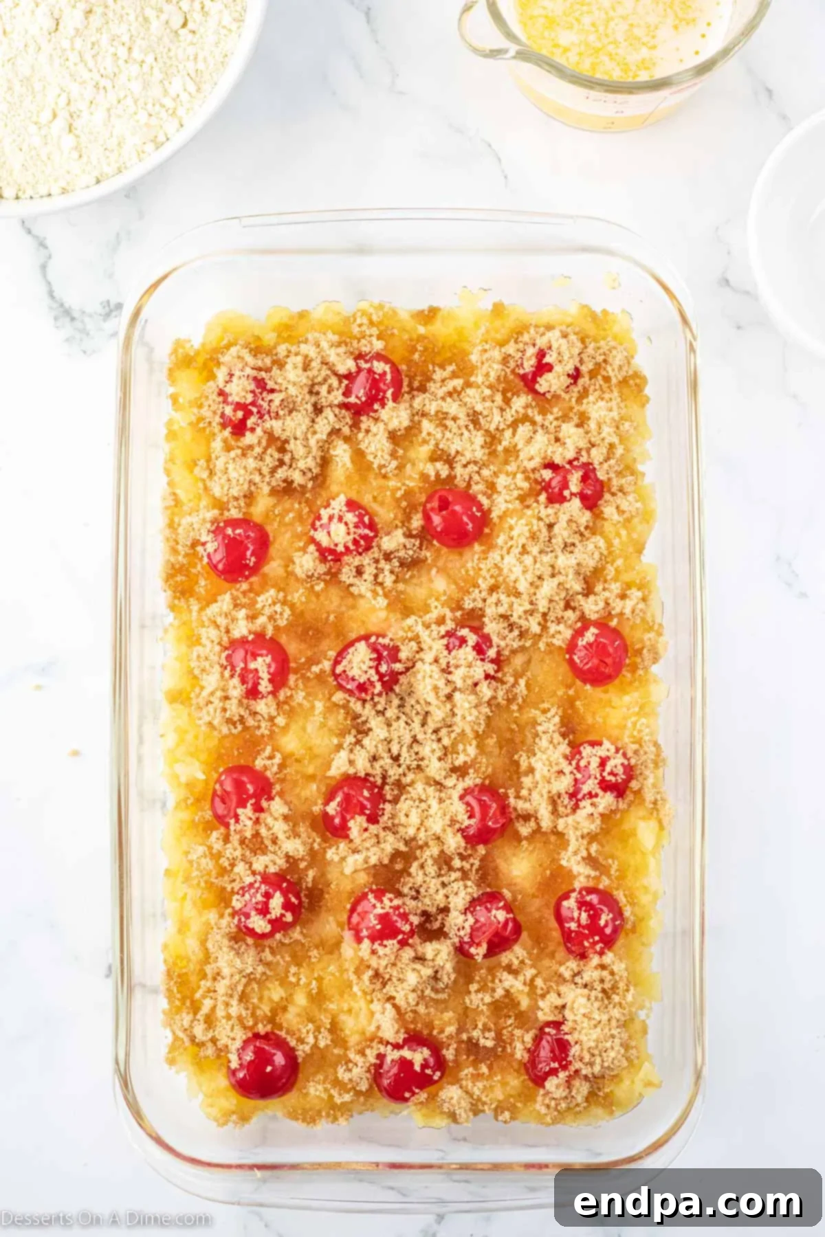 Effortless Pineapple Upside Down Delight 5 Brown sugar sprinkled on top of fruit.