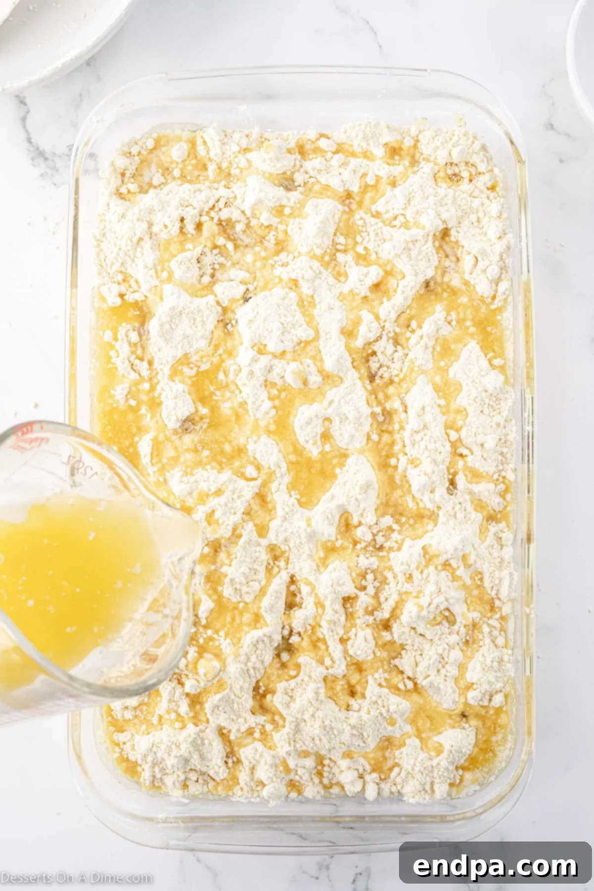 Effortless Pineapple Upside Down Delight 7 Melted butter poured on cake.