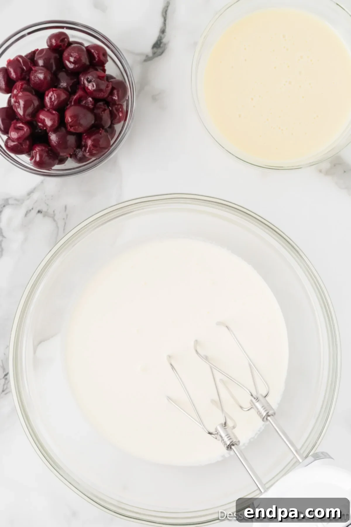 Dark Cherry Chocolate Dream Ice Cream 4 Large mixing bowl with chilled heavy cream, ready for whipping.