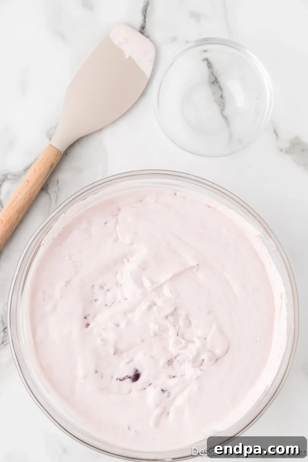 Dark Cherry Chocolate Dream Ice Cream 7 The ice cream mixture, with chocolate chips gently folded in, in a mixing bowl.