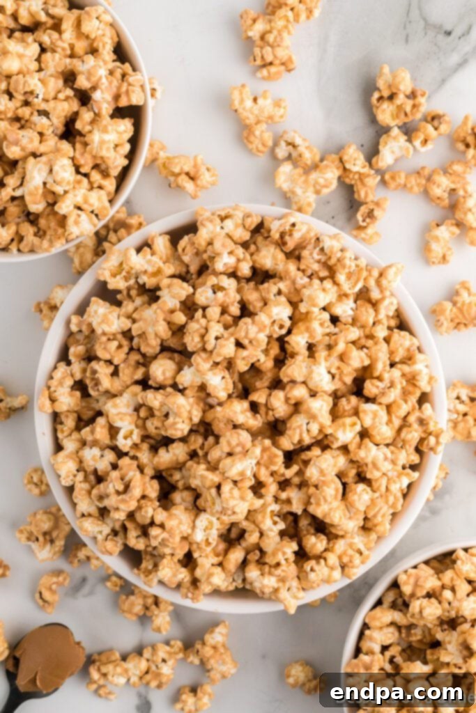 A close-up shot of Cookie Butter Popcorn piled high in a rustic bowl, ready for serving.
