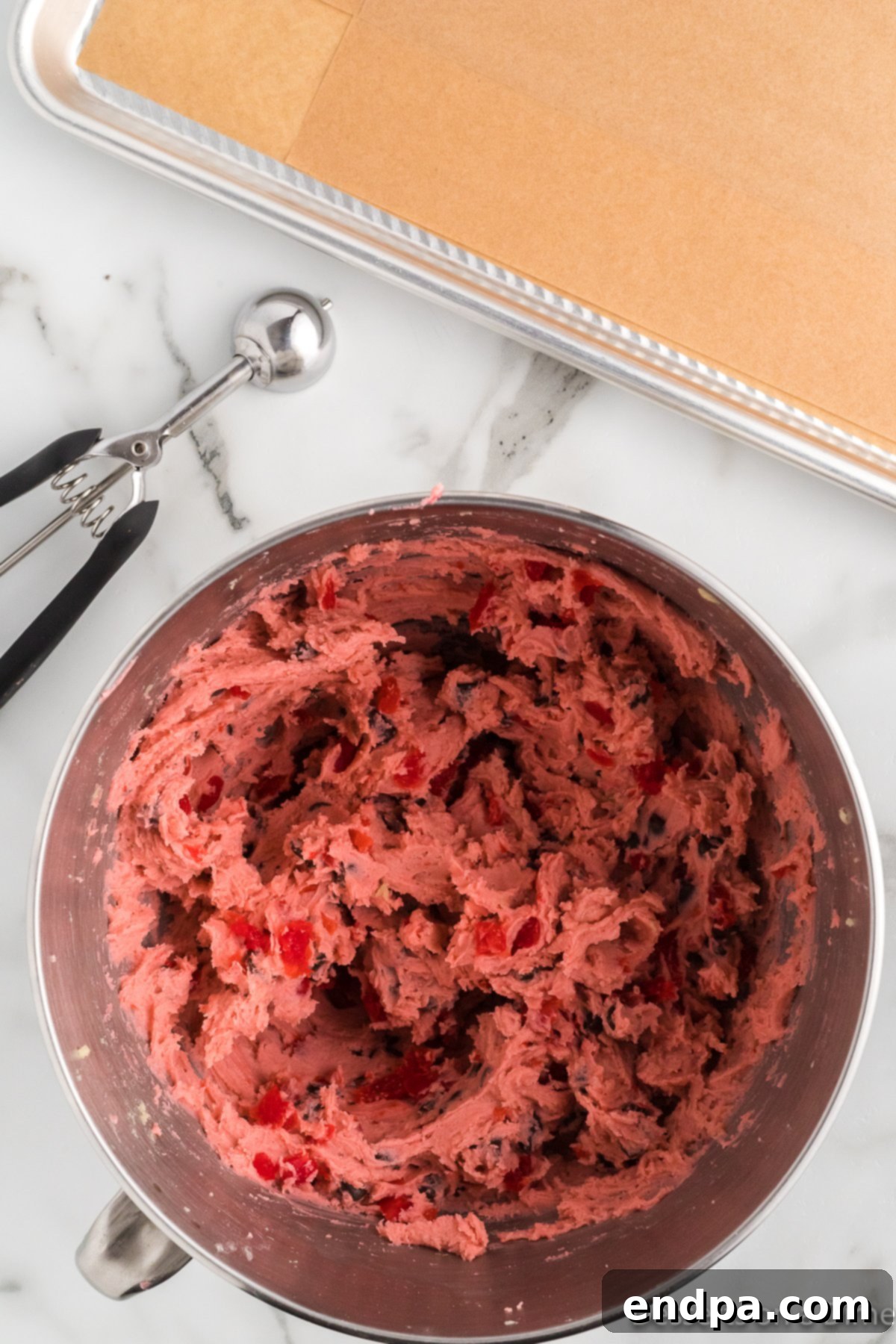 Ingredients folded together in mixing bowl for Cherry Cookies. 