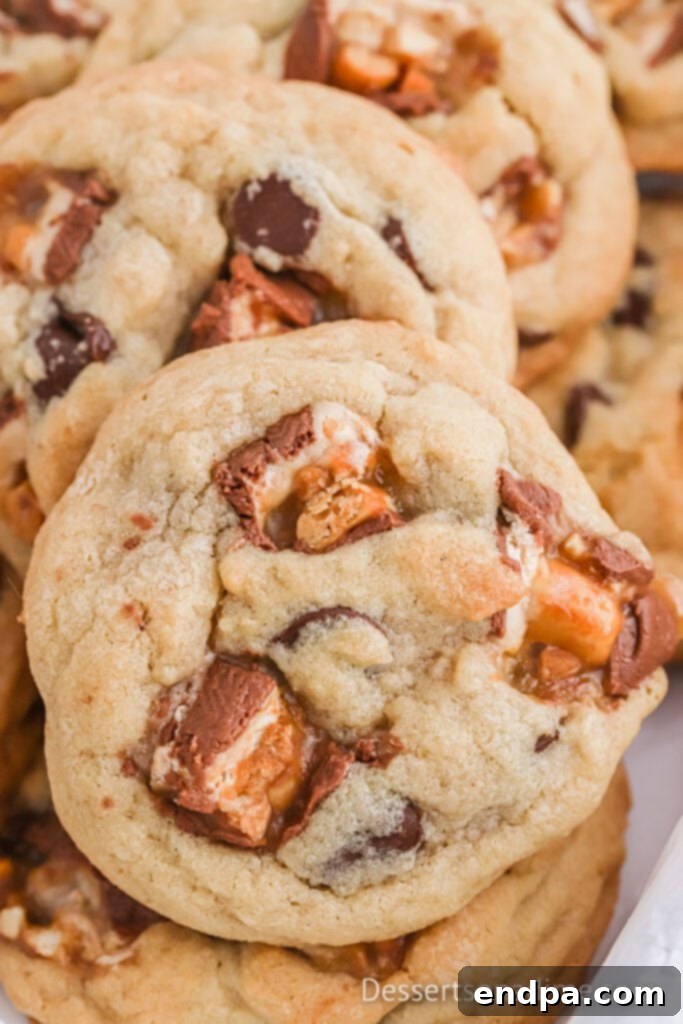 Ultimate Snickers Cookies 2 Snickers Cookies stacked together.