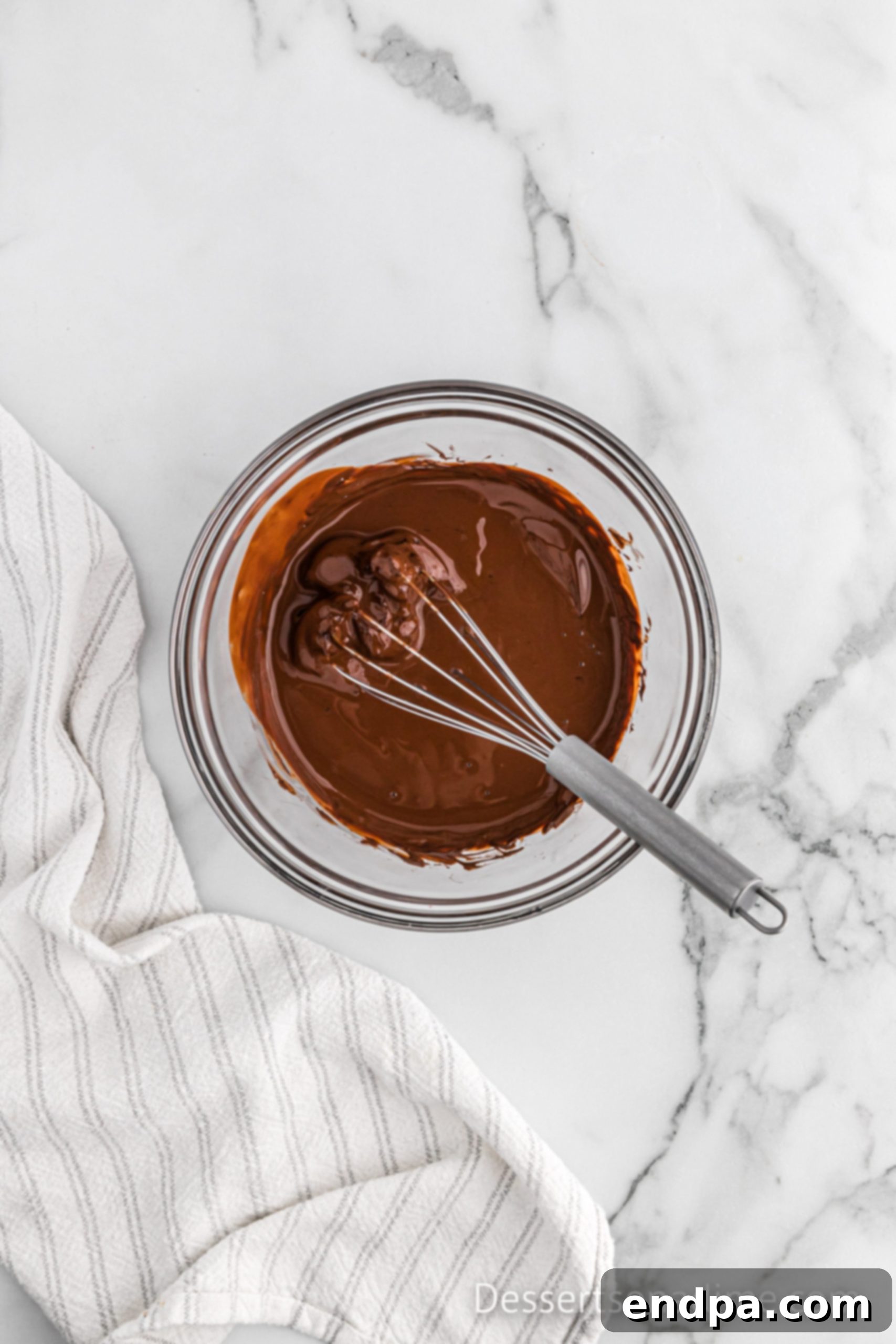 Melted chocolate chips in a bowl, ready to be mixed.