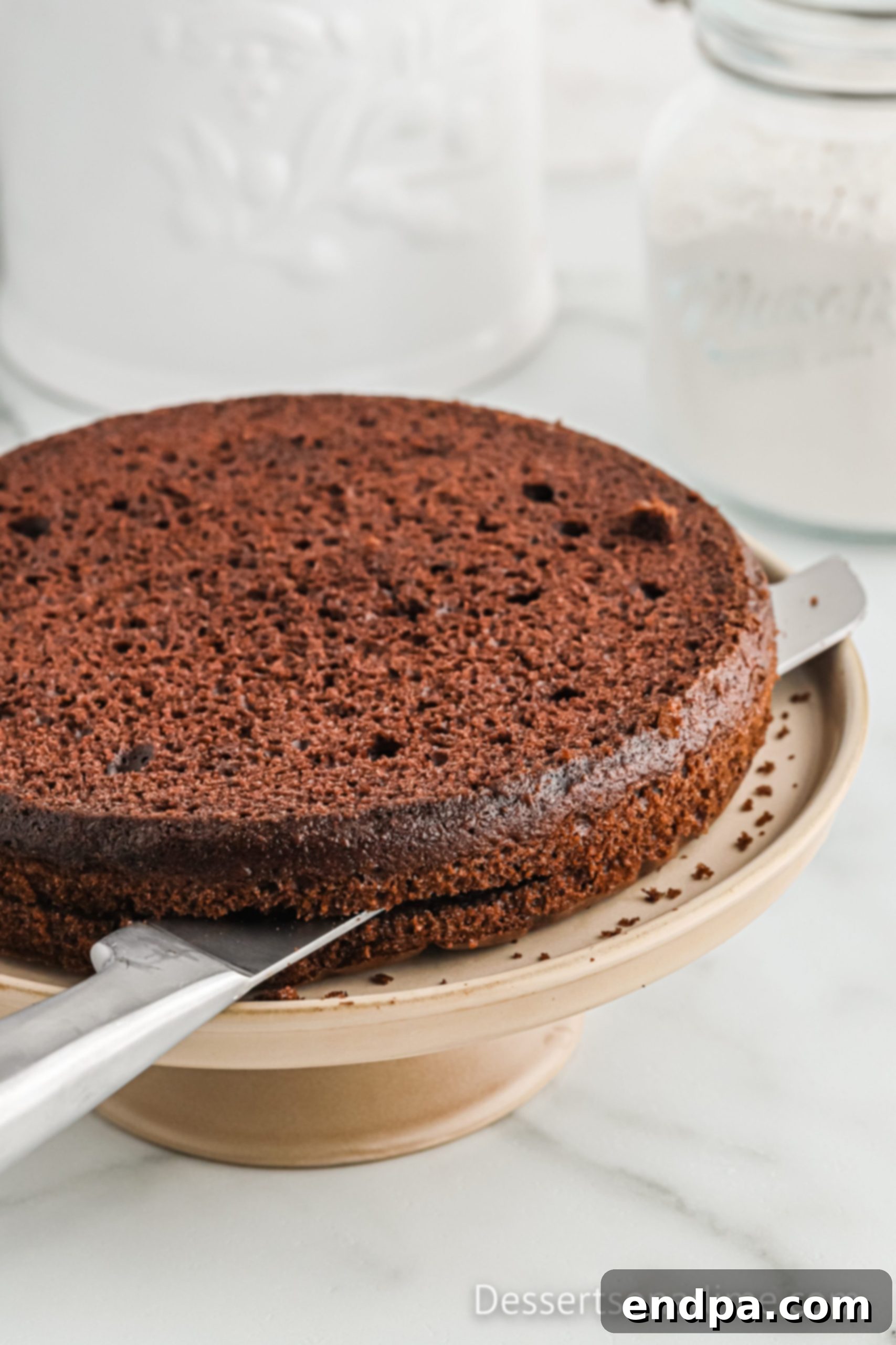 Chocolate cake layers sliced horizontally, ready for assembly.