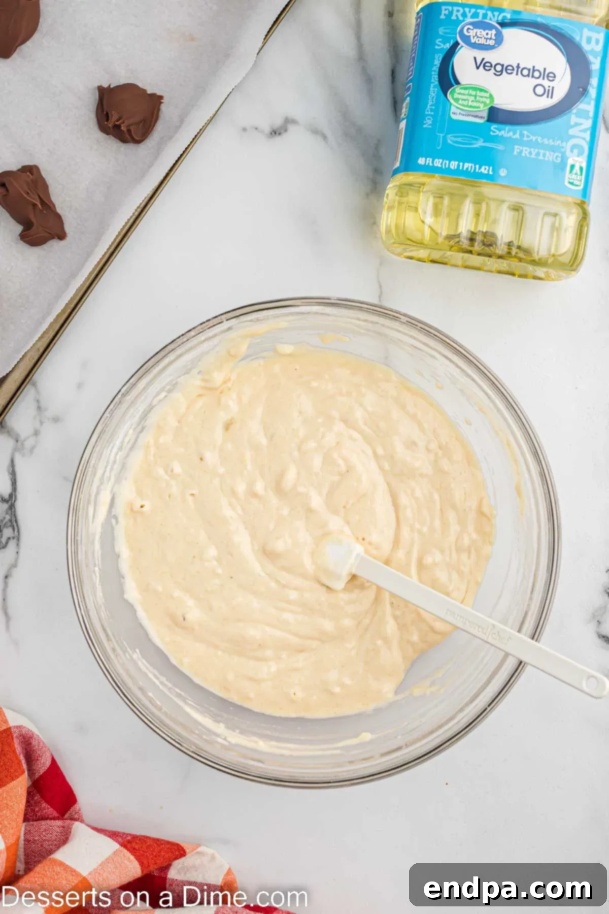 Pancake batter ingredients, including pancake mix, milk, and vegetable oil, are combined in a mixing bowl.