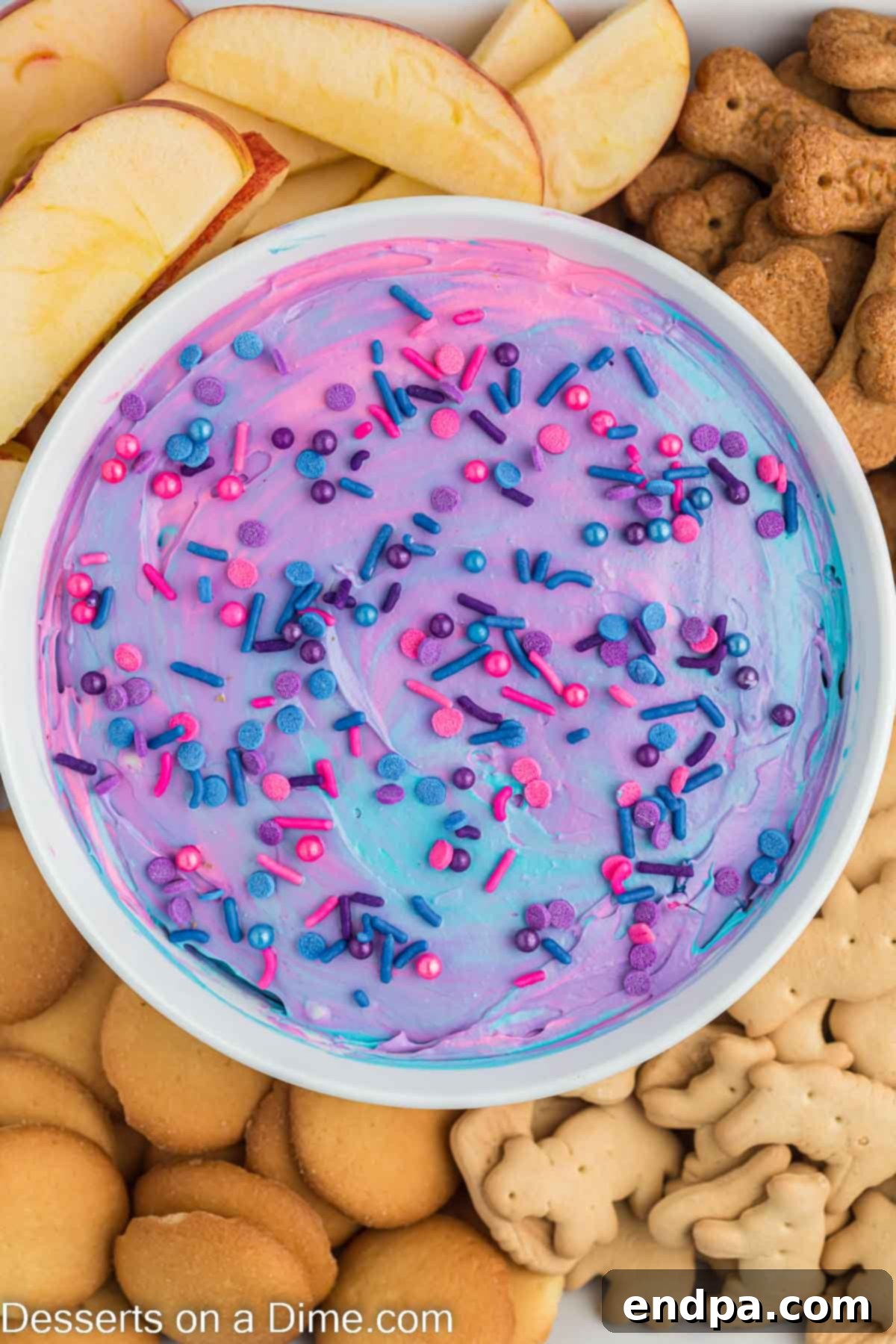 Unicorn dip in a bowl surrounded by dippers. 