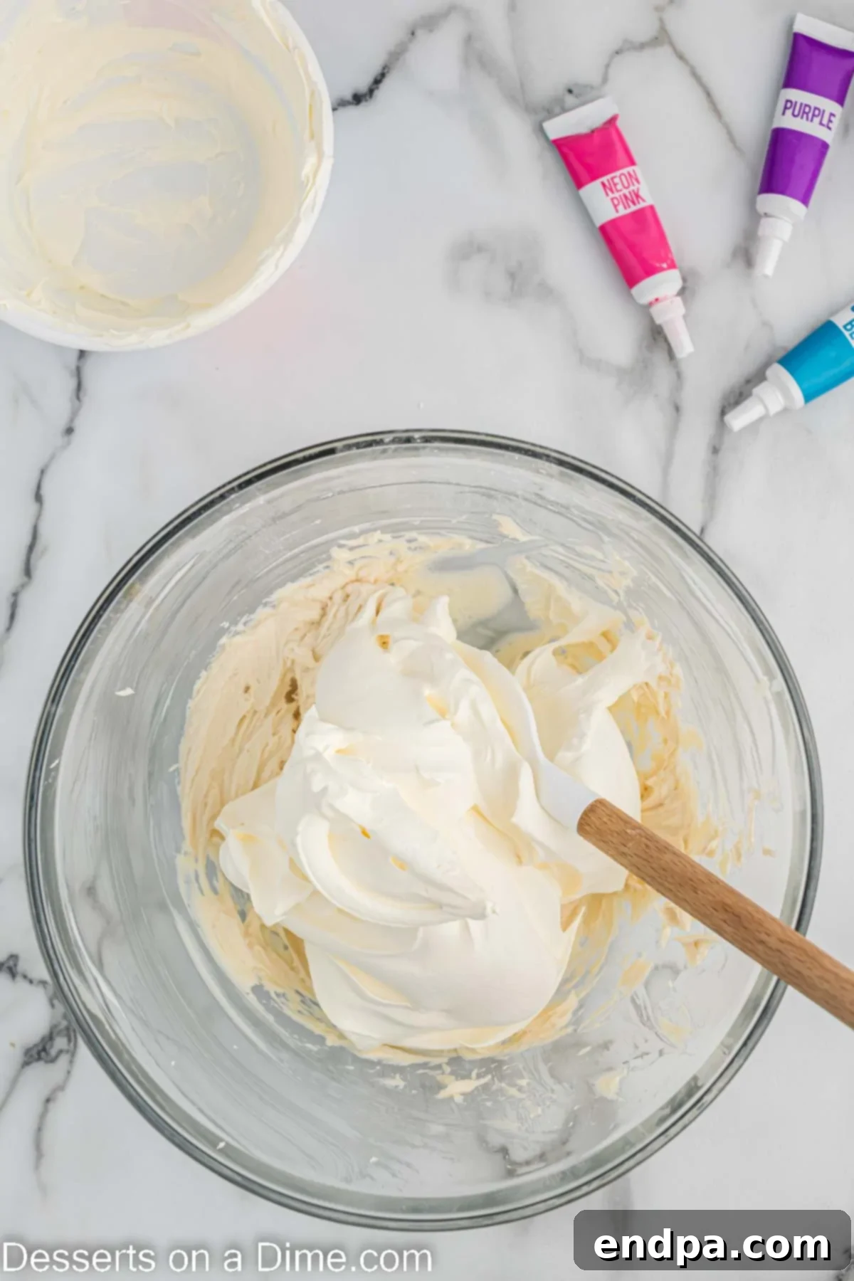 Whipped cream folded into cream cheese mixture. 