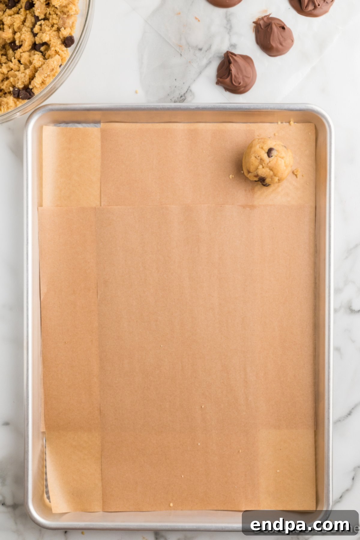 Ultimate Nutella Bomb Cookies 11 Cookie dough balls placed on baking sheet.