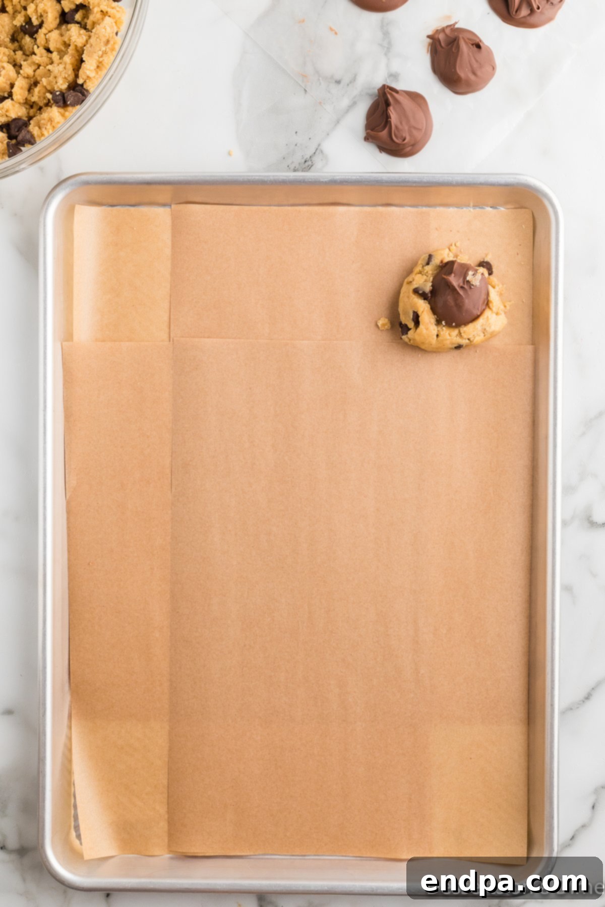 Ultimate Nutella Bomb Cookies 12 Frozen nutella placed on dough.