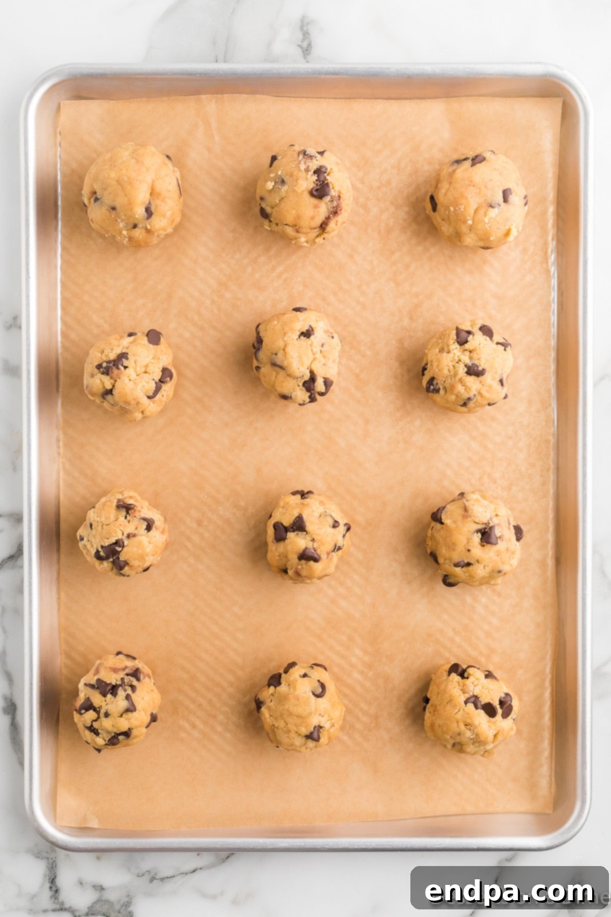 Ultimate Nutella Bomb Cookies 13 Dough placed on top of nutella and smoothed out.