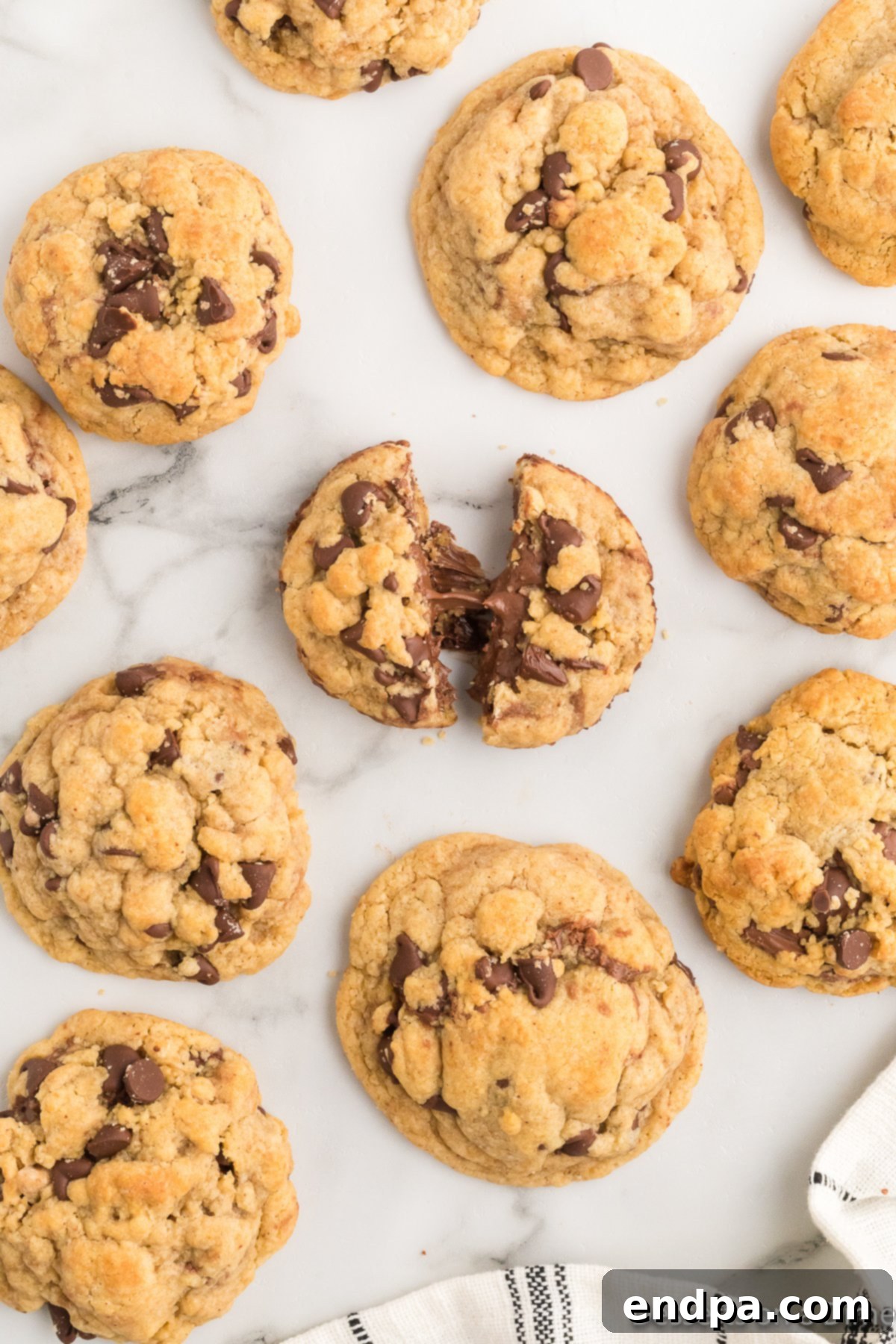 Ultimate Nutella Bomb Cookies 16 Nutella stuffed cookies on the counter.