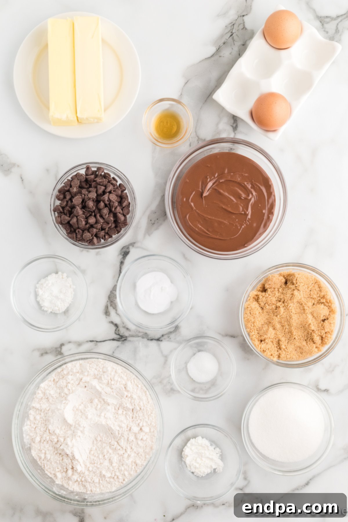 Ultimate Nutella Bomb Cookies 3 Ingredients for Nutella stuffed cookies - butter, nutella, brown sugar, eggs, vanilla, baking soda, flour, chocolate chips.