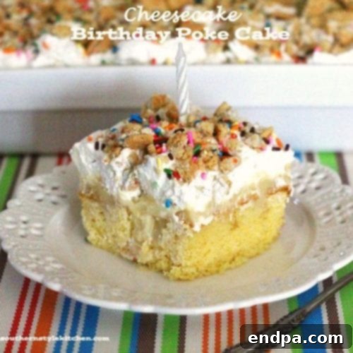 A festive slice of Cheesecake Birthday Poke Cake, decorated with sprinkles and candles.