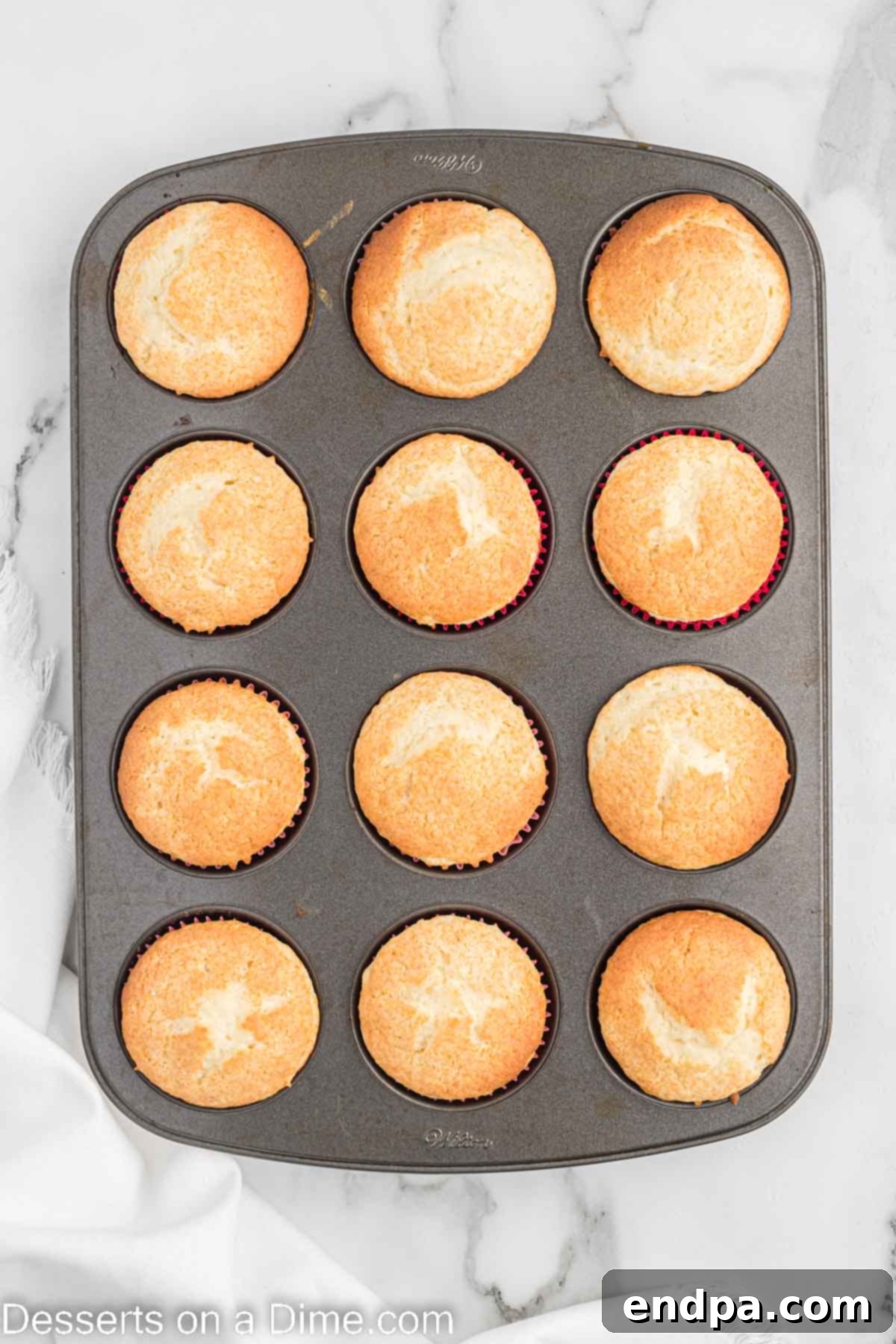 Baked cupcakes cooling in the muffin pan.