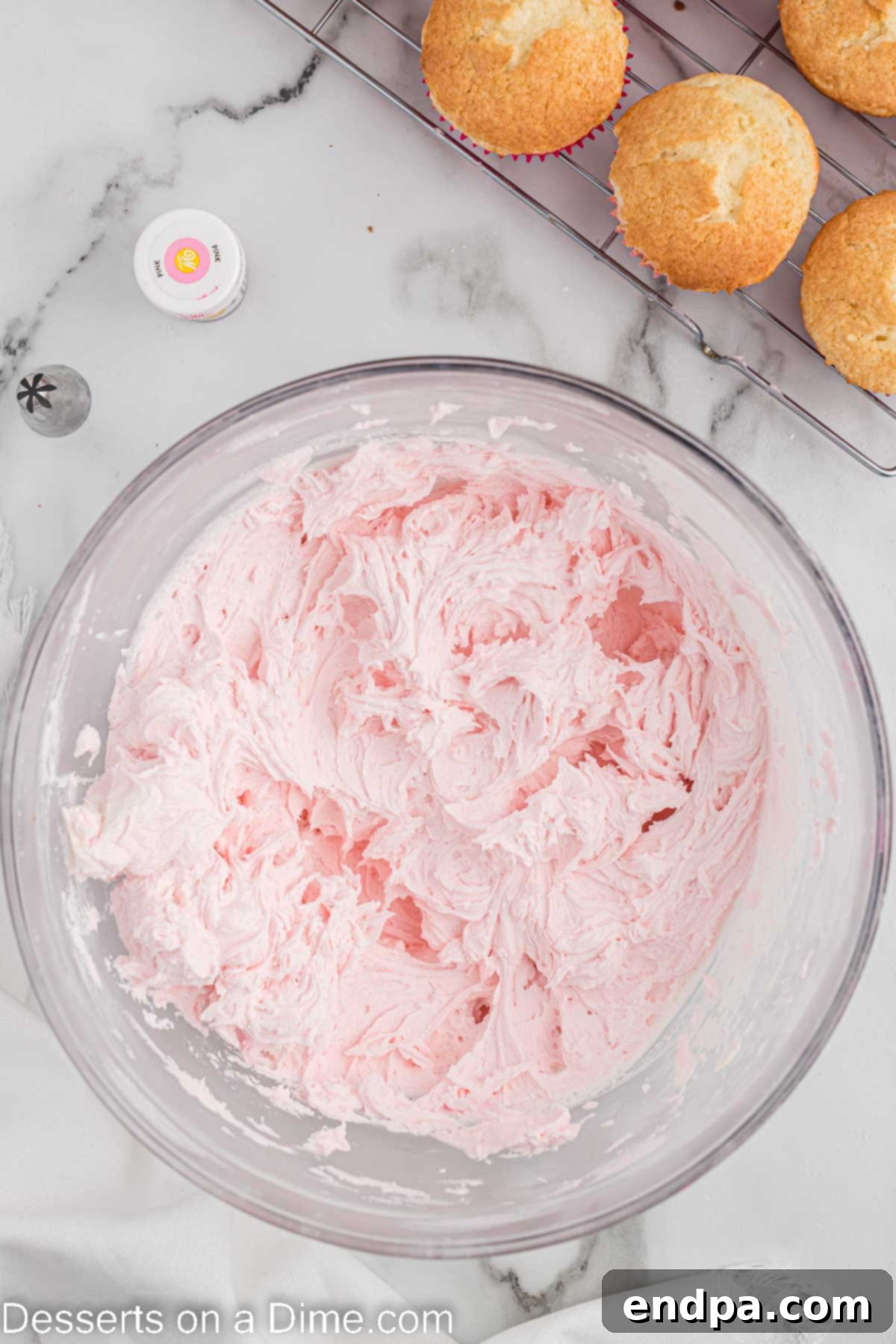 Powdered sugar being gradually added to the butter and shortening mixture.