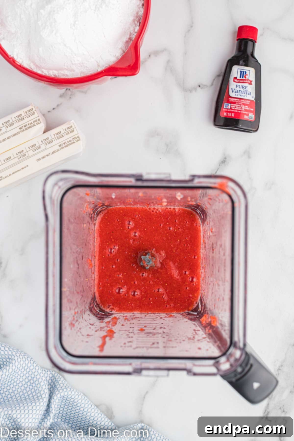 Luscious Strawberry Buttercream 4 Strawberries in a blender.