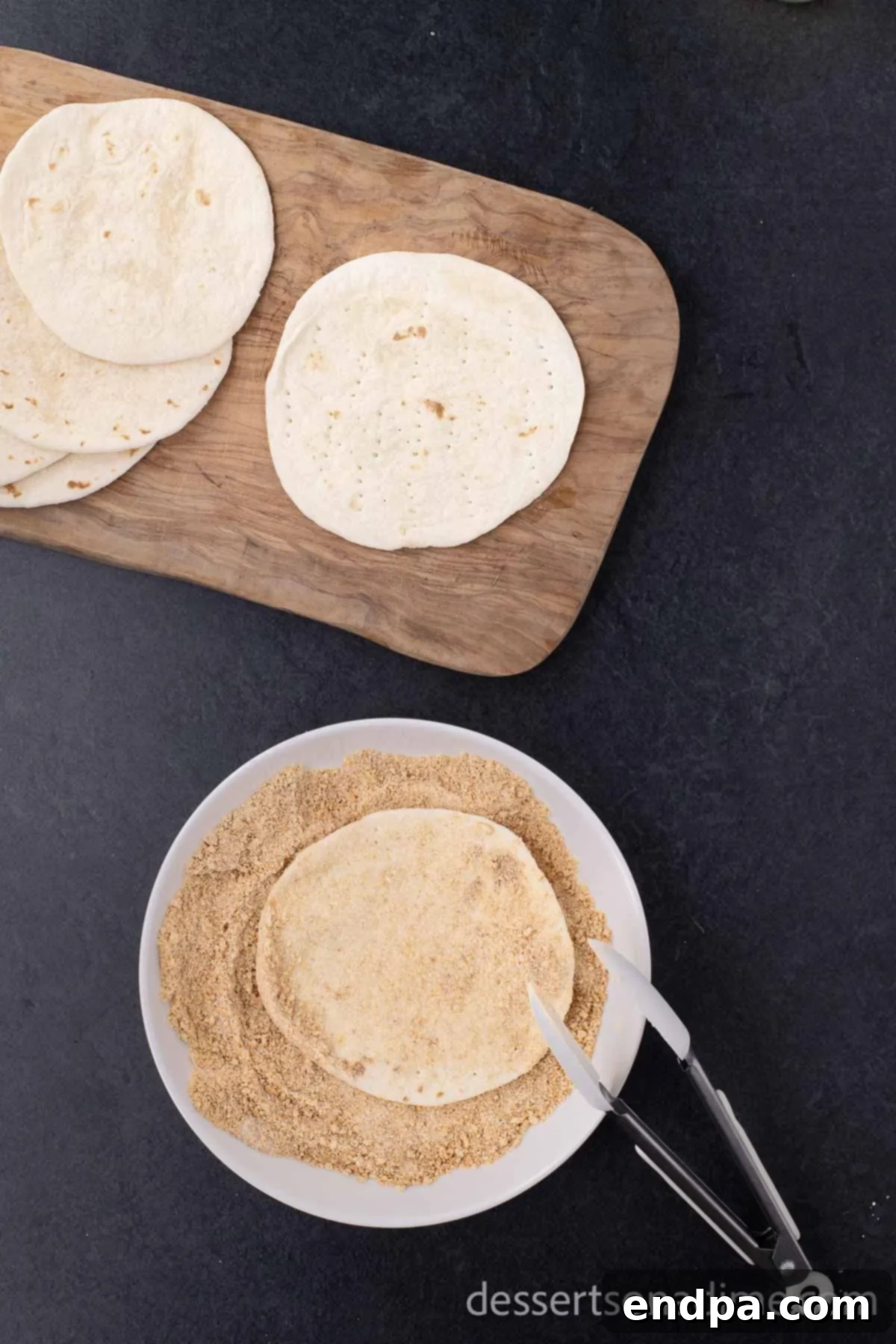 Heavenly Cherry Cheesecake Tacos 5 Flour tortilla being dipped into the graham cracker and sugar mixture.