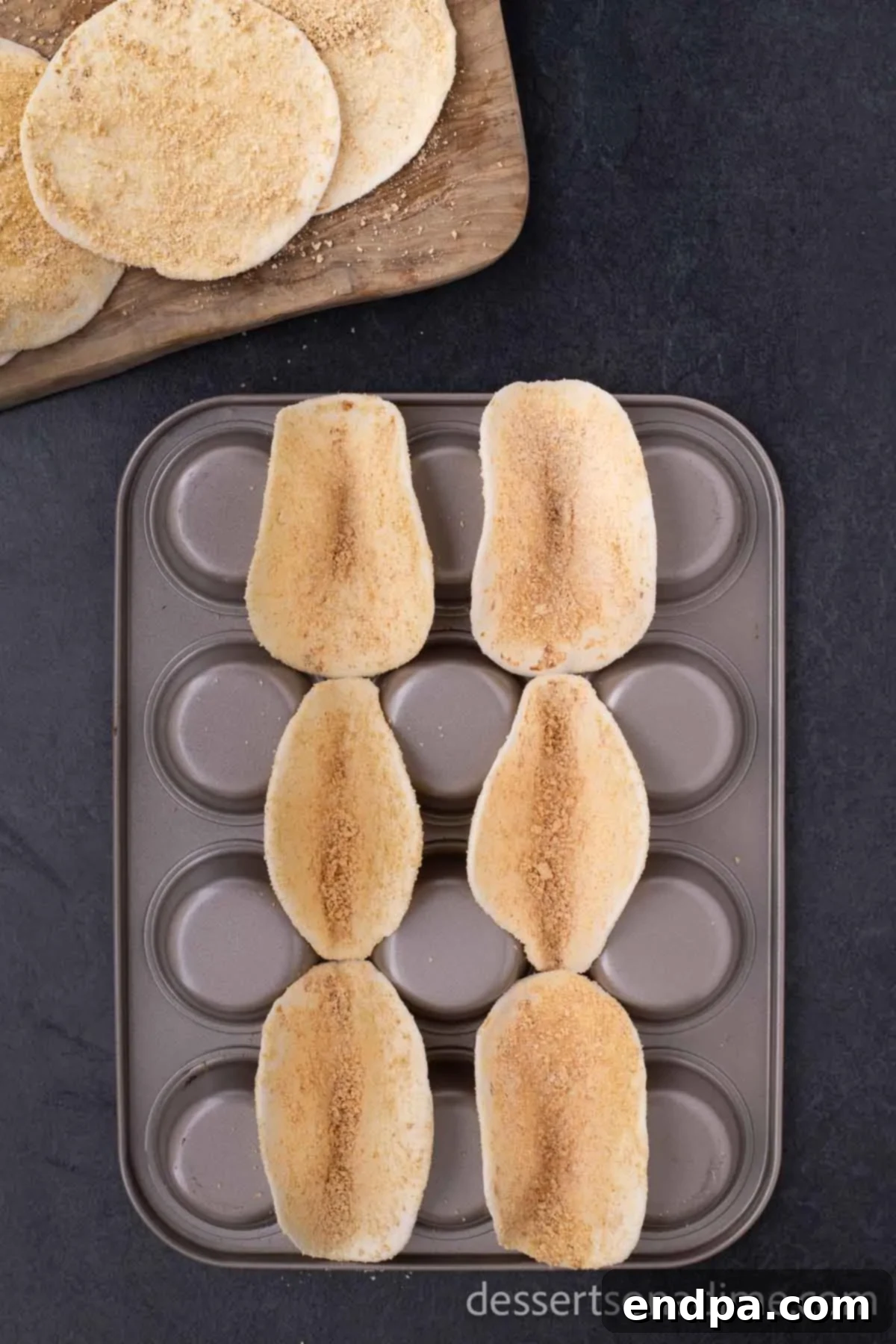 Heavenly Cherry Cheesecake Tacos 6 Crispy taco shells cooling on an inverted muffin pan.